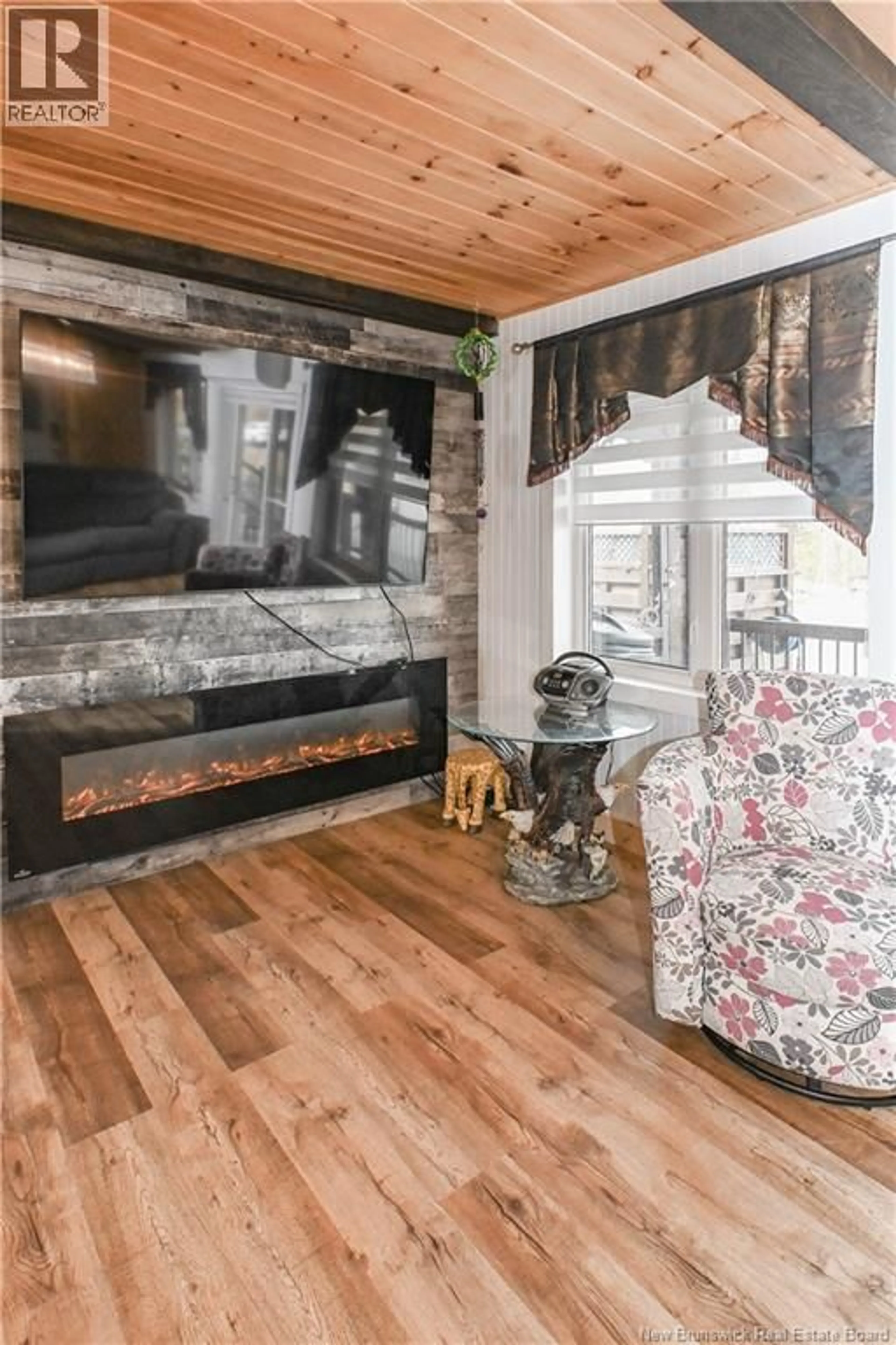 Living room with furniture, wood/laminate floor for 3663 LUCE STREET, Tracadie New Brunswick E1X1B4