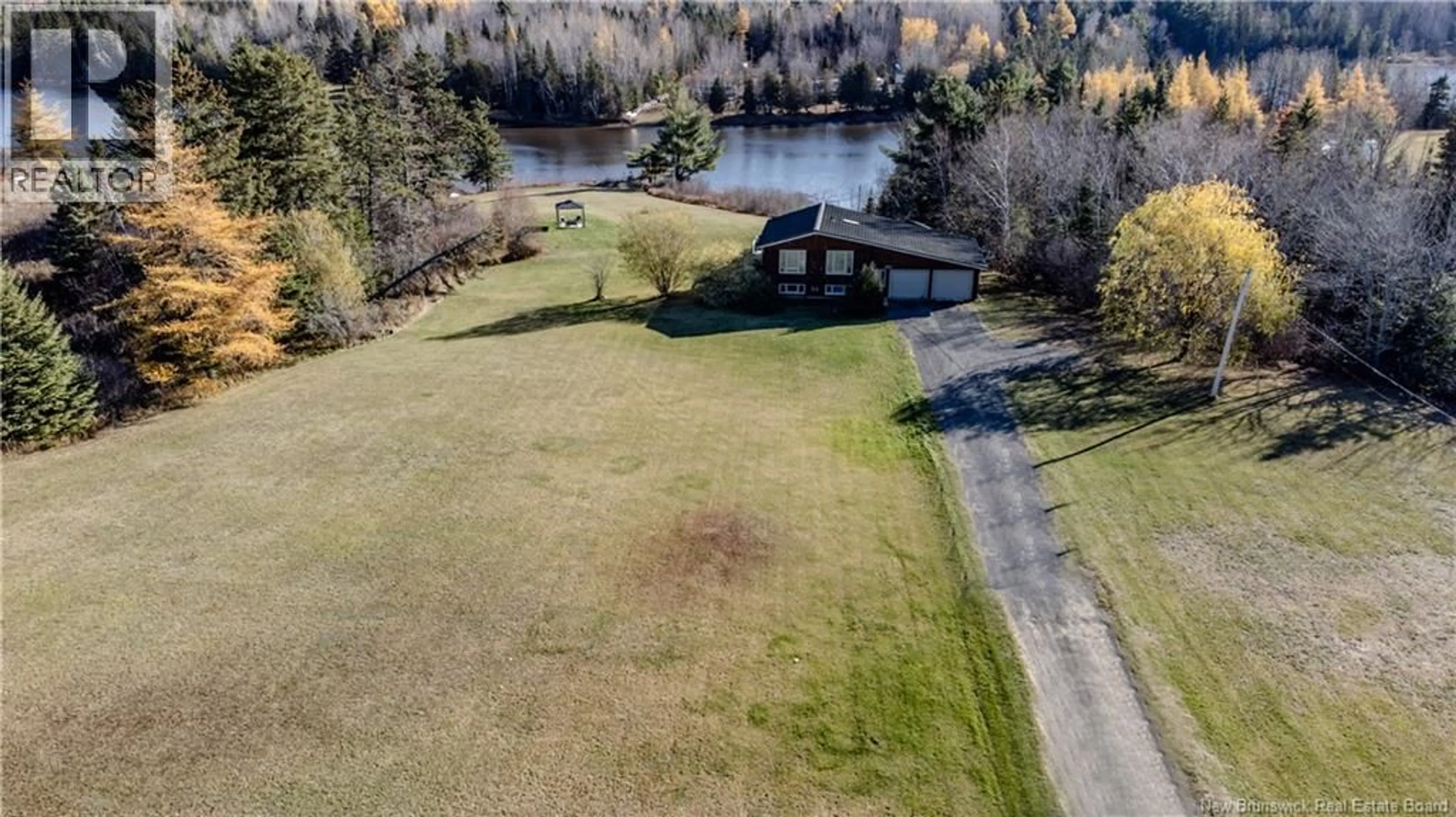 A pic from outside/outdoor area/front of a property/back of a property/a pic from drone, water/lake/river/ocean view for 699 SAINT CHARLES NORD ROAD, Saint-Charles New Brunswick E4W4R9
