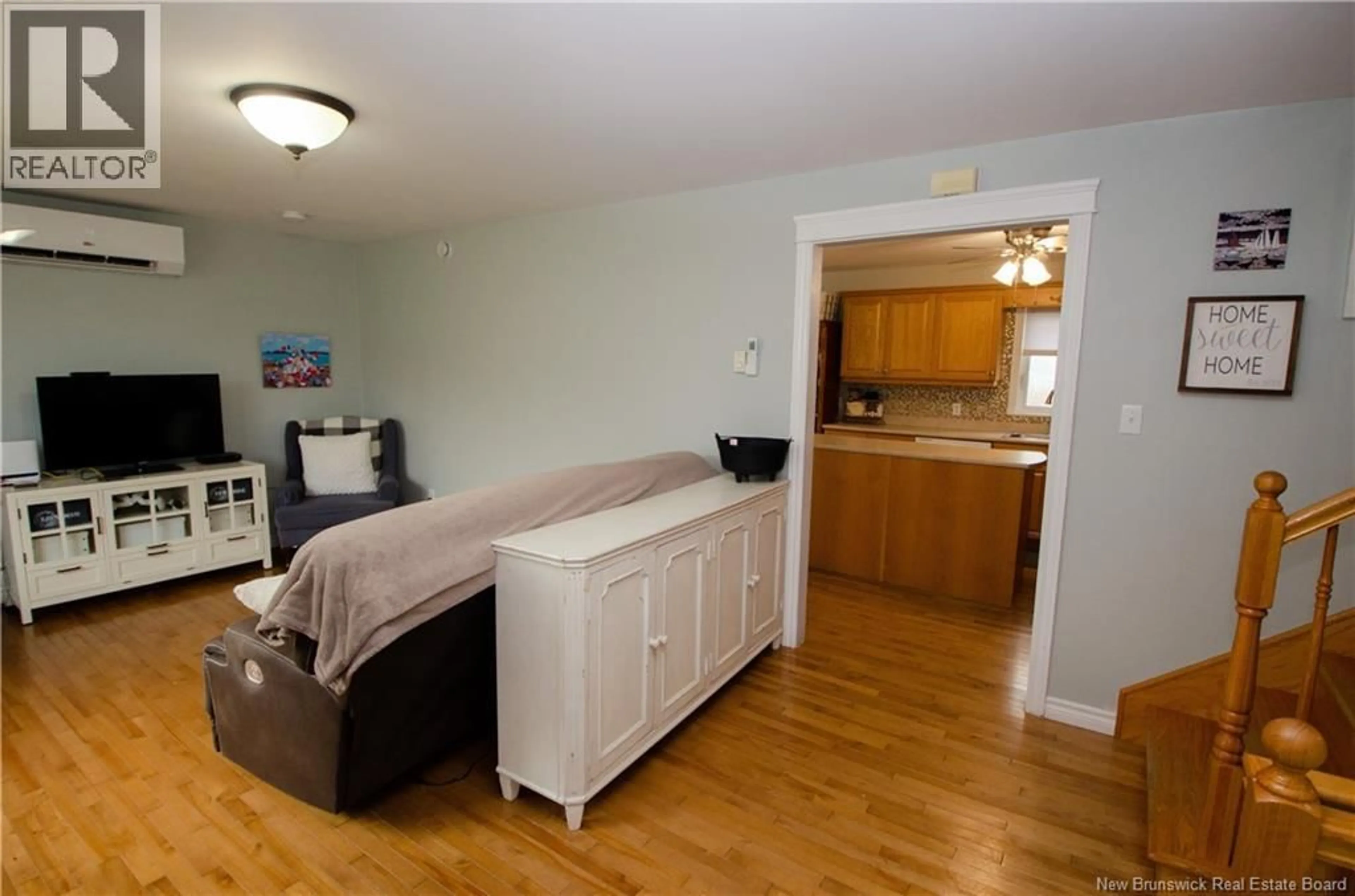 Living room with furniture, wood/laminate floor for 5 MCCARRON DRIVE, Quispamsis New Brunswick E2E4N4