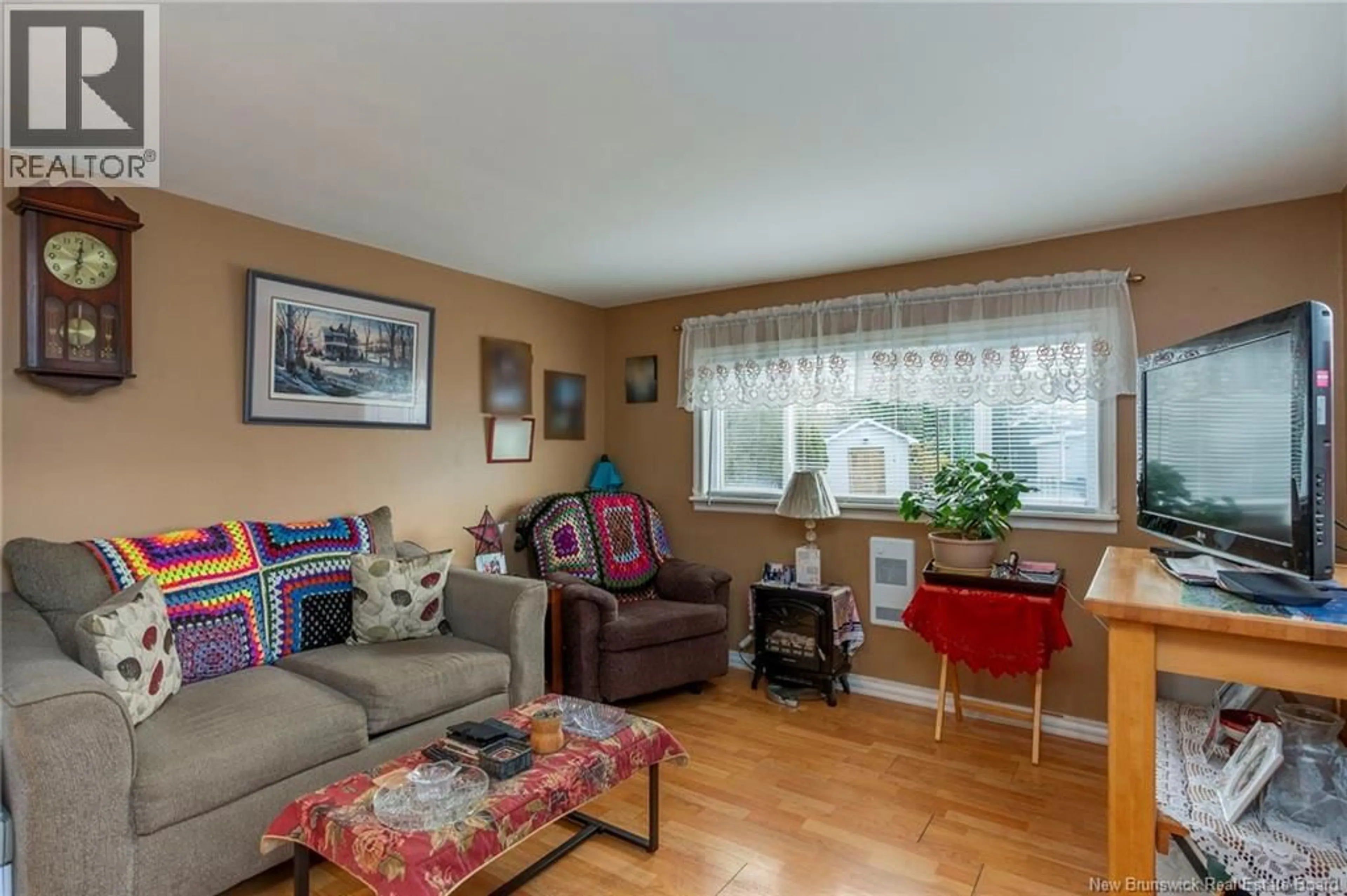 Living room with furniture, wood/laminate floor for 25 SWALLOW STREET, Saint John New Brunswick E2J2S4