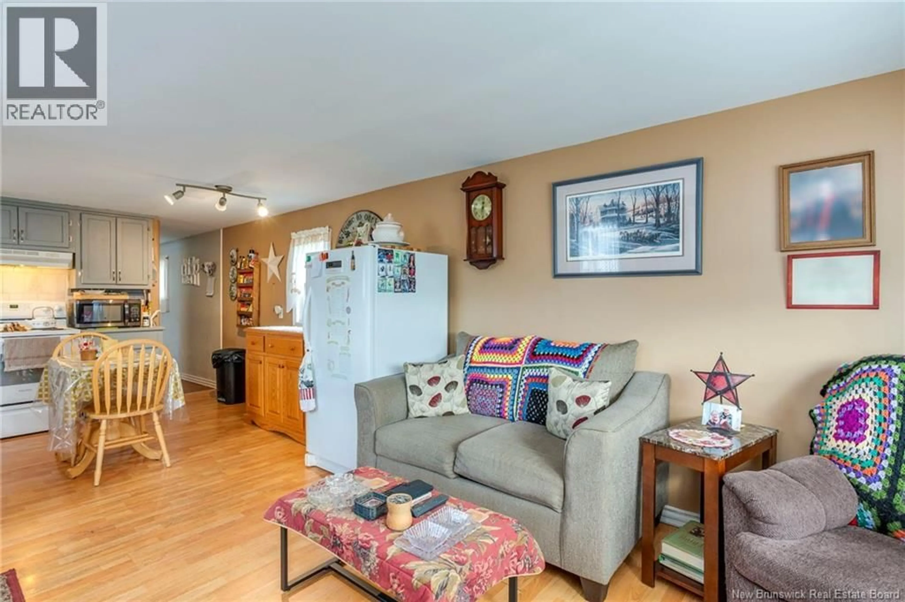 Living room with furniture, wood/laminate floor for 25 SWALLOW STREET, Saint John New Brunswick E2J2S4