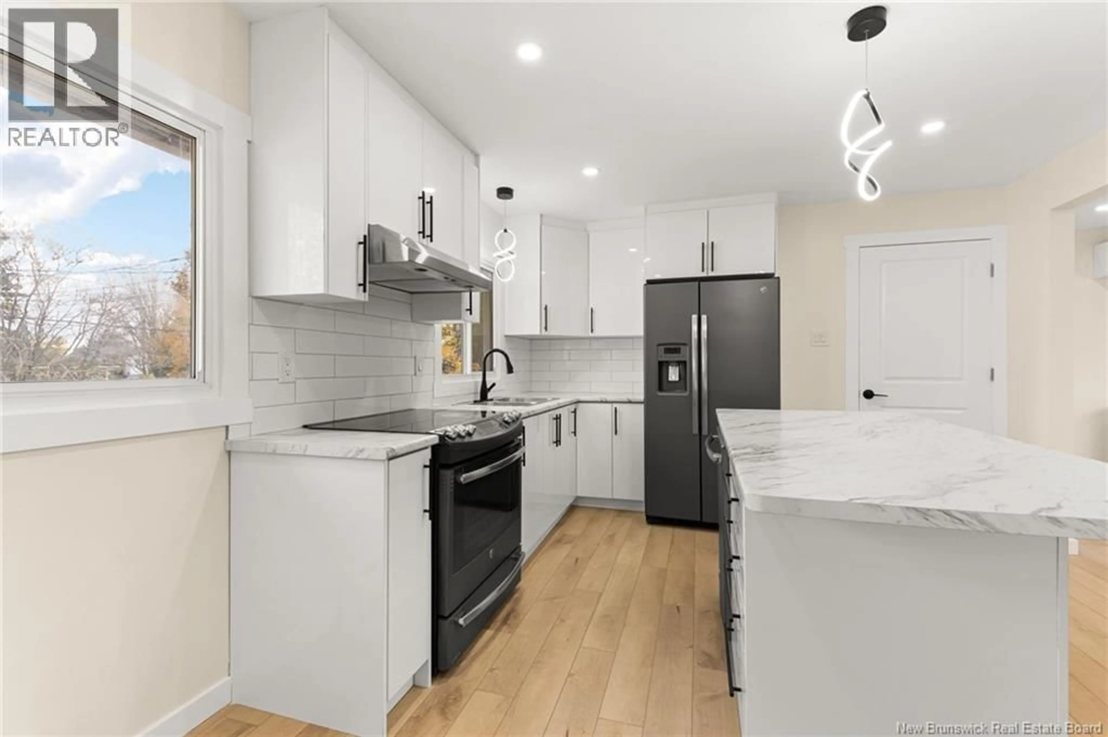 Open concept kitchen, ceramic/tile floor for 33-35 COVENTRY CRESCENT, Moncton New Brunswick E1C8G5