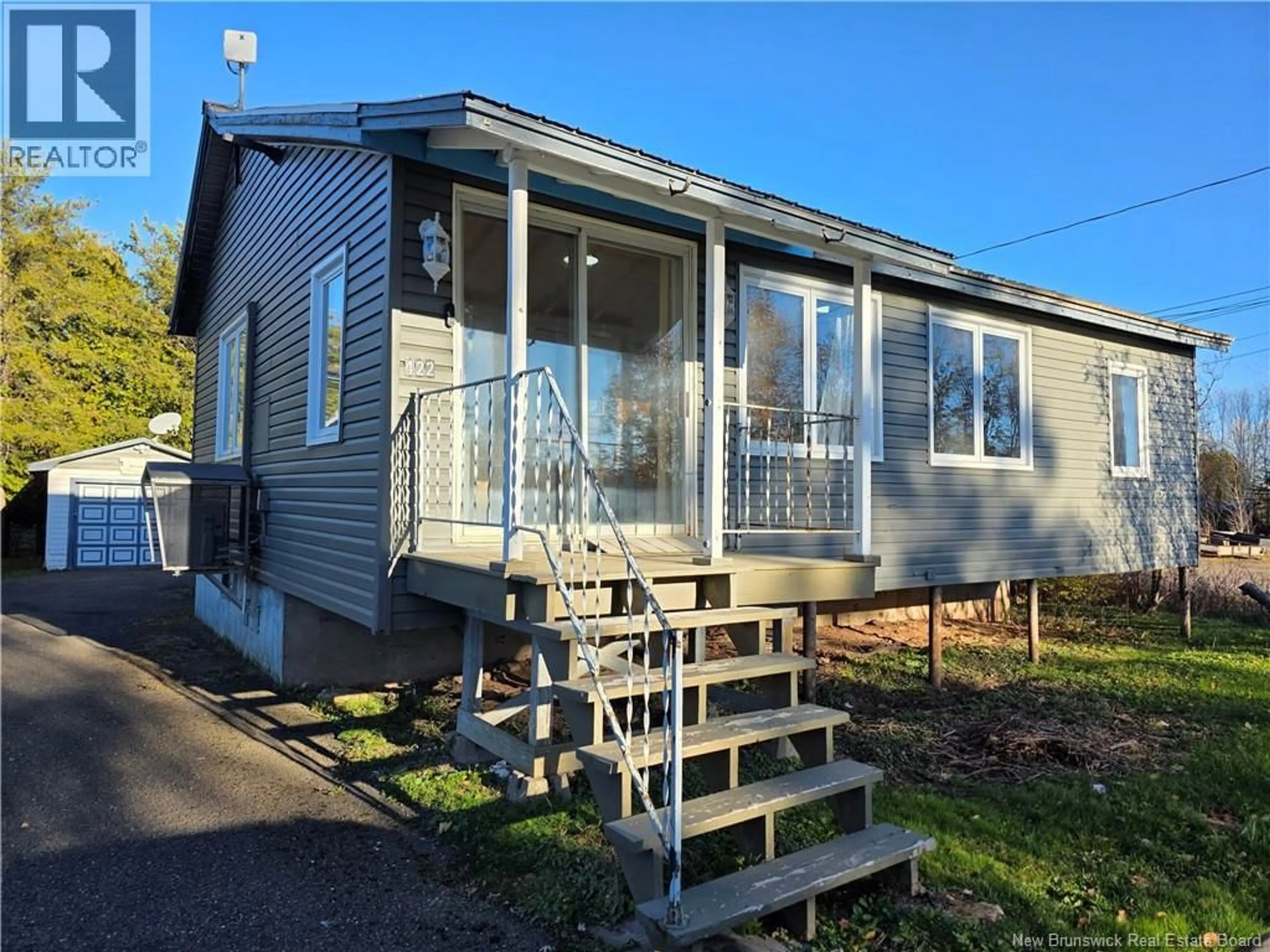 Home with vinyl exterior material, street for 422 TOBIQUE STREET, Plaster Rock New Brunswick E7G3Z7