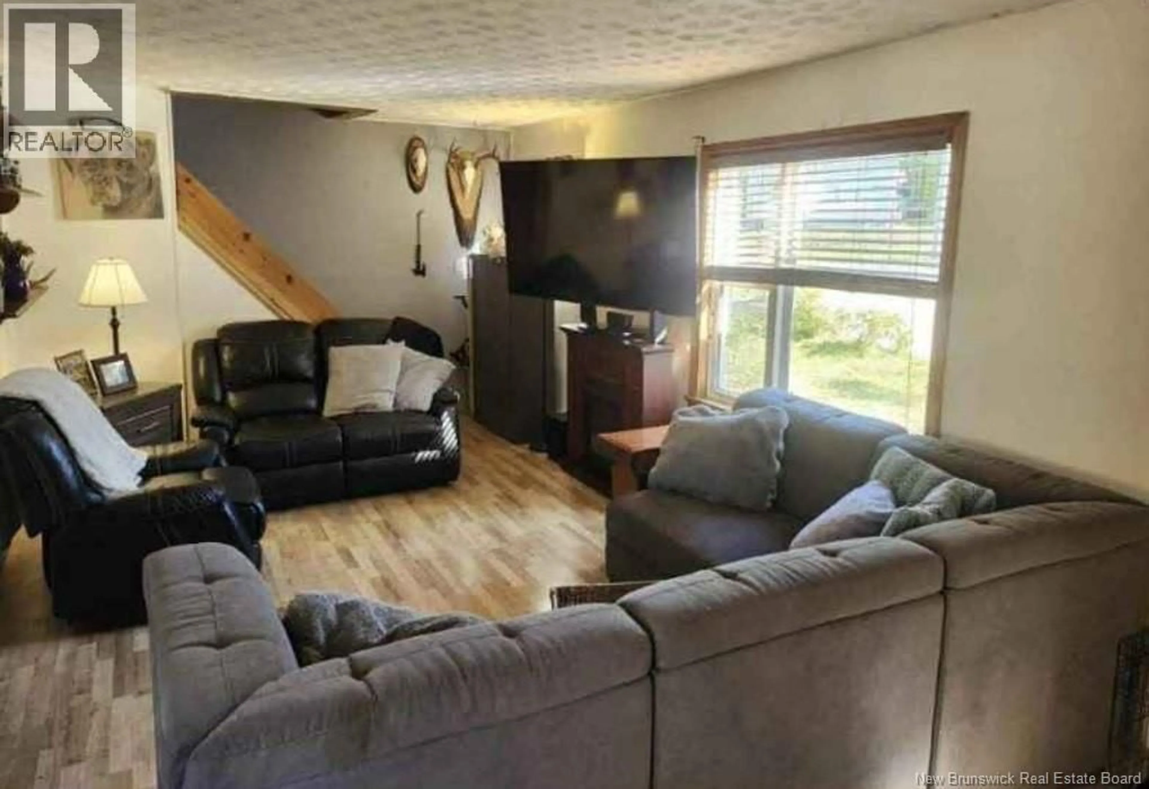 Living room with furniture, wood/laminate floor for 105 BEAVERBROOK AVENUE, Saint John New Brunswick E2K2W8