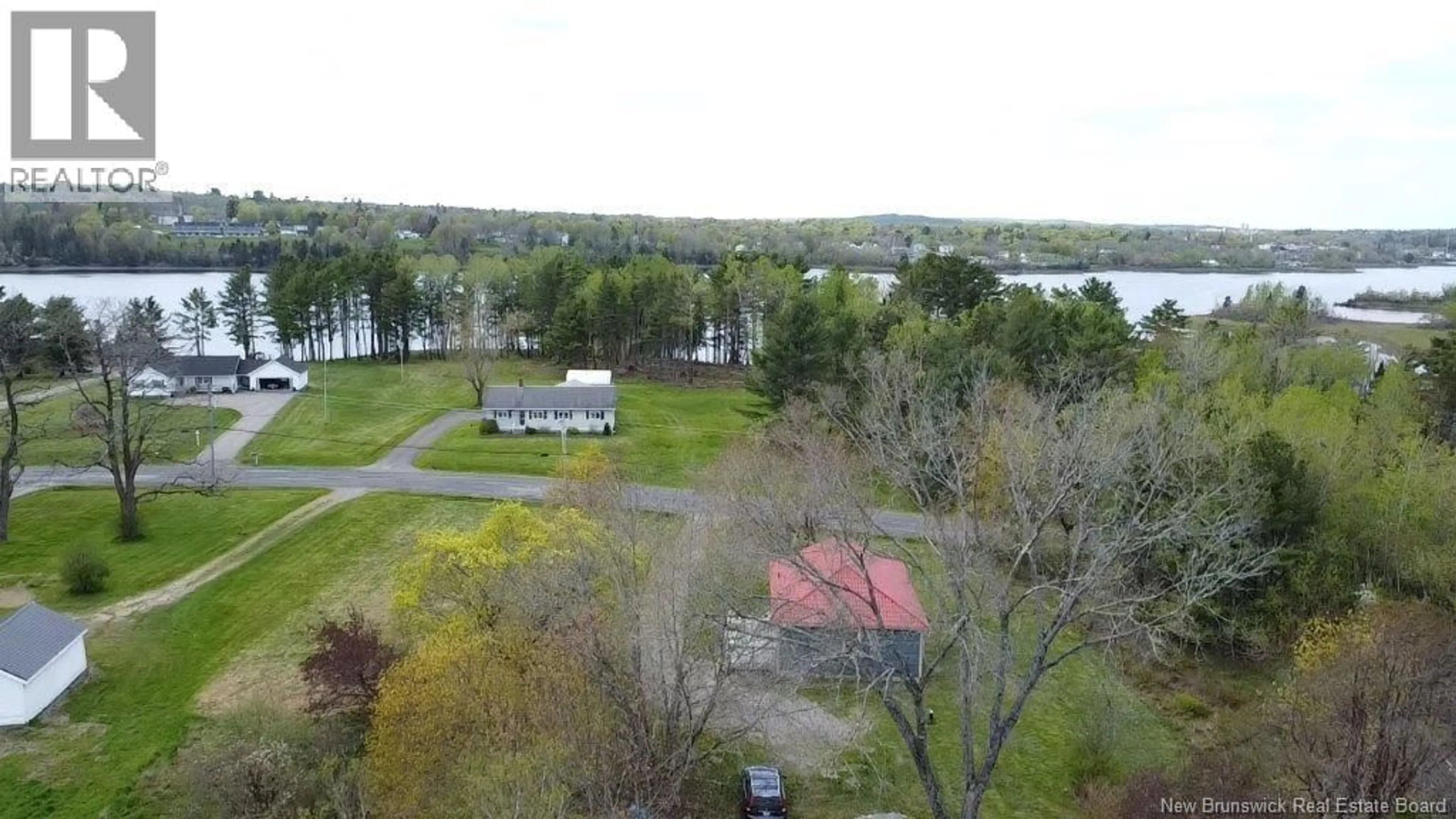 A pic from outside/outdoor area/front of a property/back of a property/a pic from drone, water/lake/river/ocean view for 204 LEDGE ROAD, Dufferin New Brunswick E3L3P2