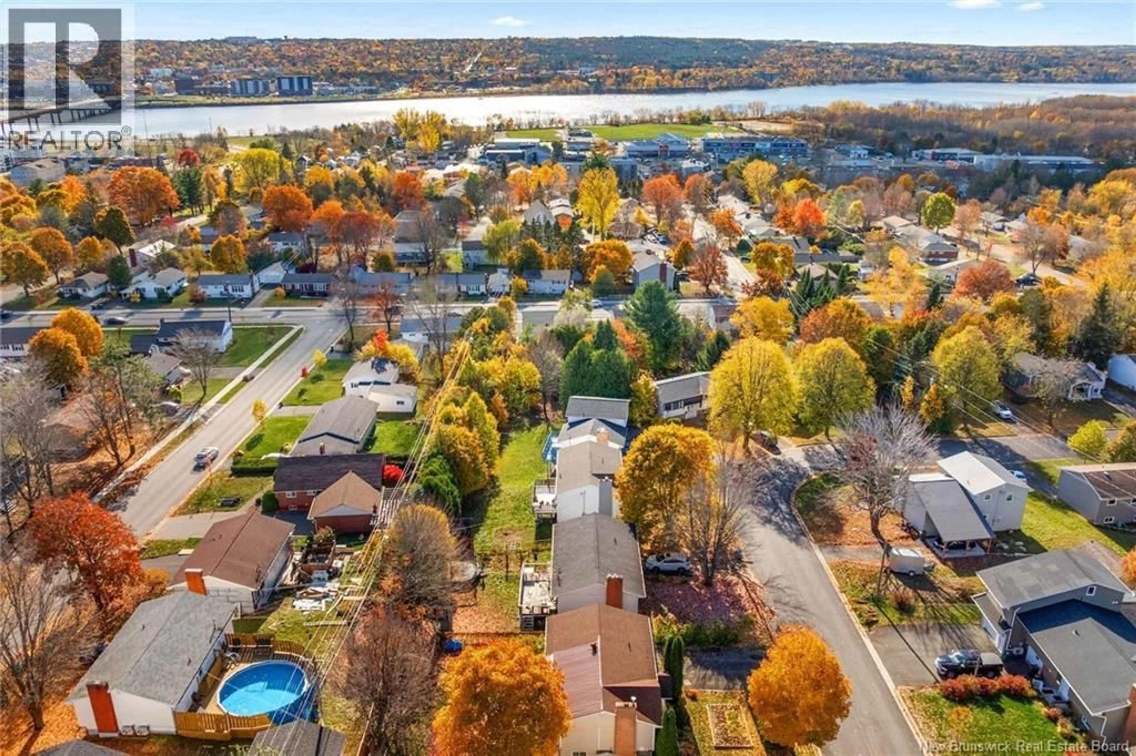A pic from outside/outdoor area/front of a property/back of a property/a pic from drone, water/lake/river/ocean view for 32 LINDEN CRESCENT, Fredericton New Brunswick E3A4Z9
