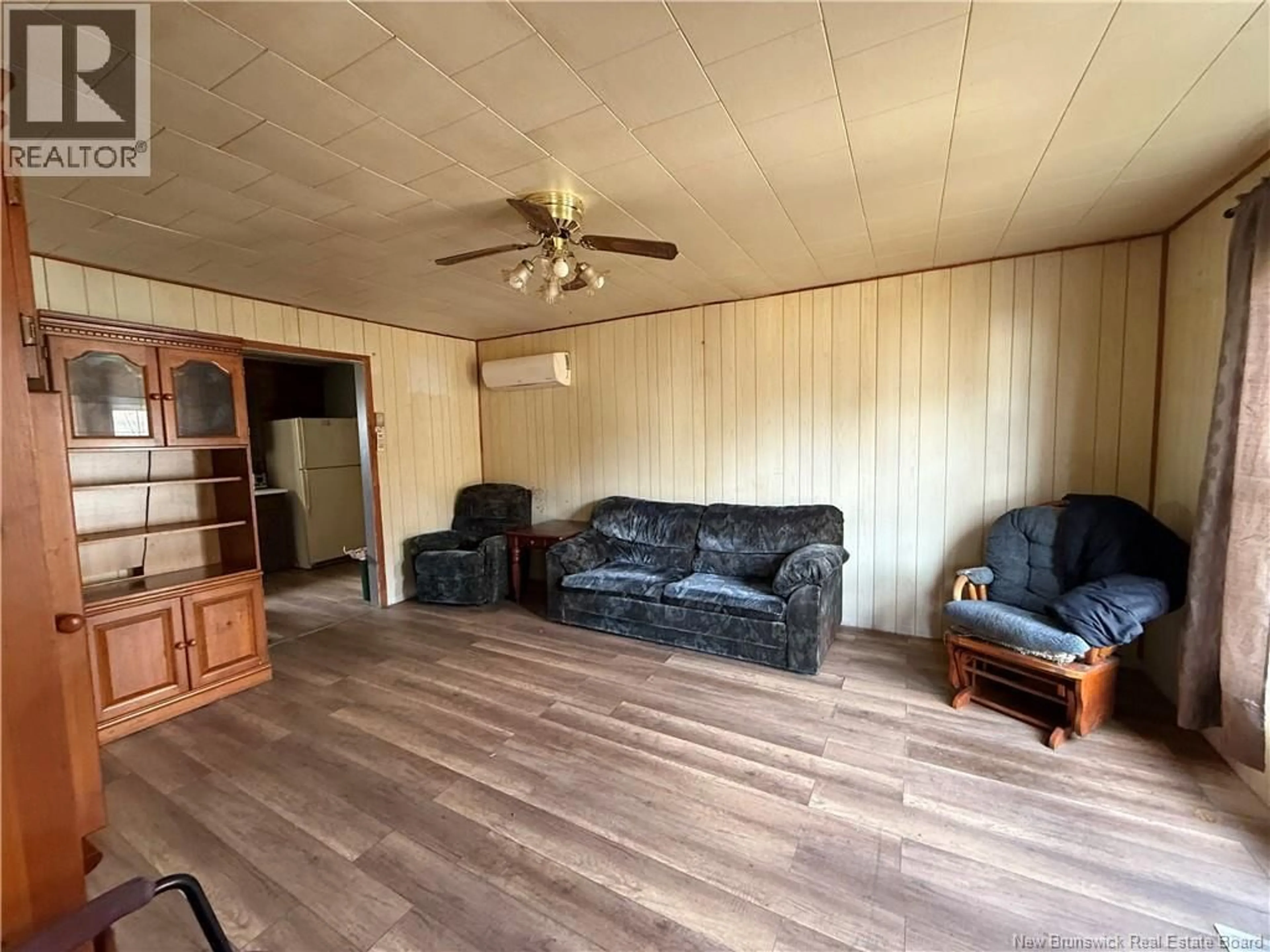Living room with furniture, wood/laminate floor for 9394 ROUTE 8 ROUTE, Blissfield New Brunswick E9C1Z3