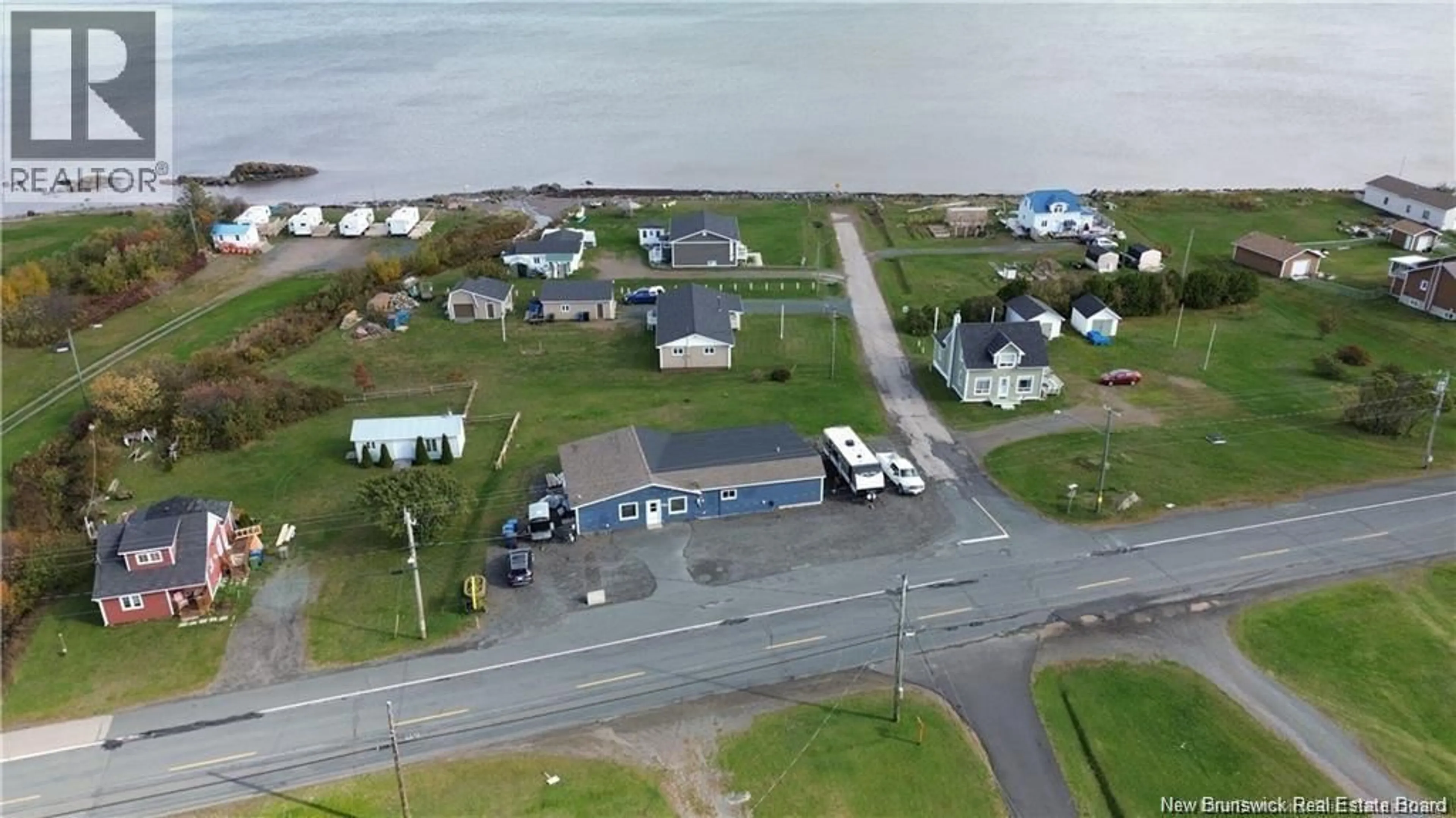 A pic from outside/outdoor area/front of a property/back of a property/a pic from drone, water/lake/river/ocean view for 563 RUE PRINCIPALE, Pointe-Verte New Brunswick E8J3A2