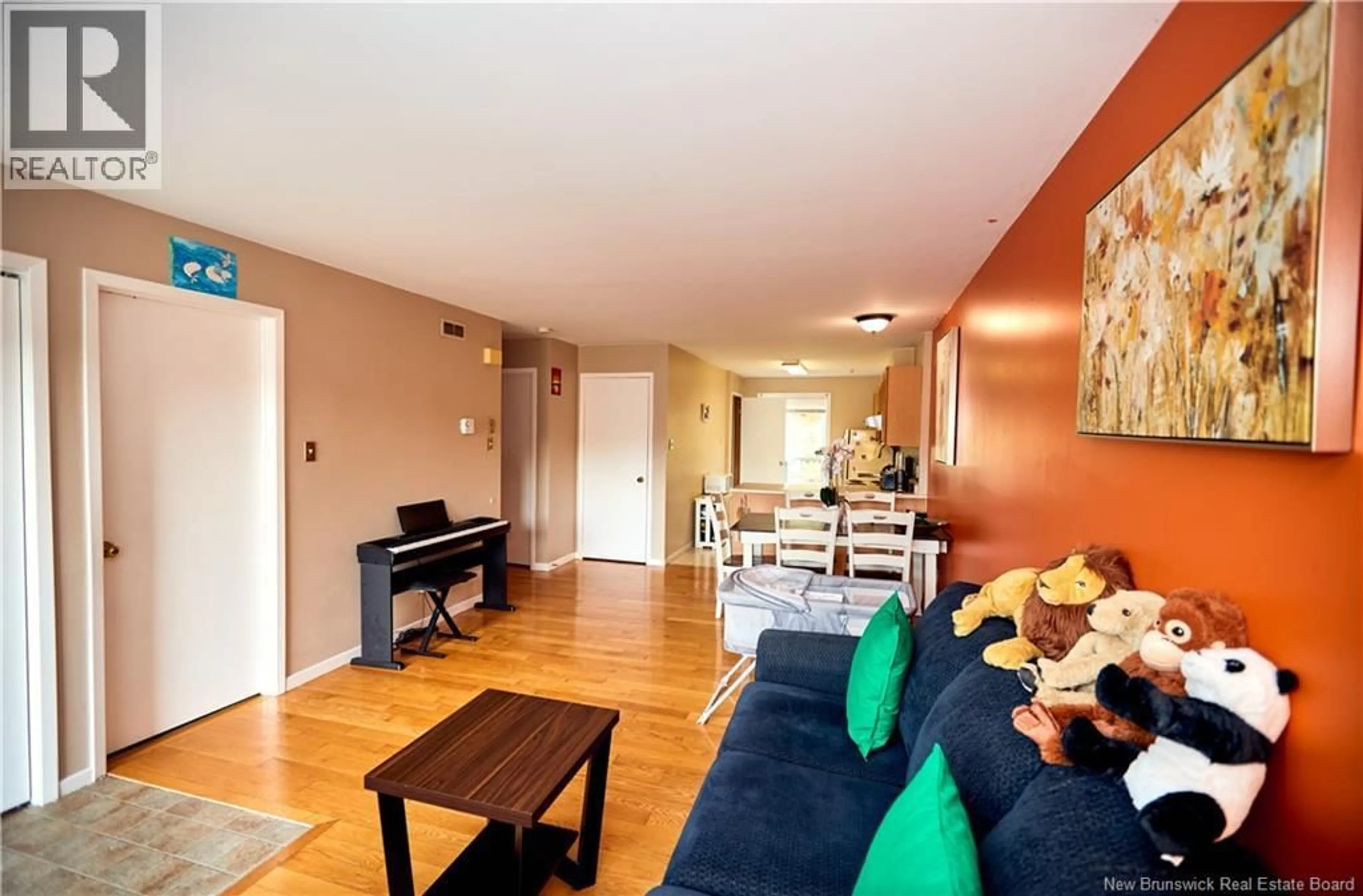 Living room with furniture, wood/laminate floor for 10 BRENTWOOD CRESCENT, Saint John New Brunswick E2K4R4
