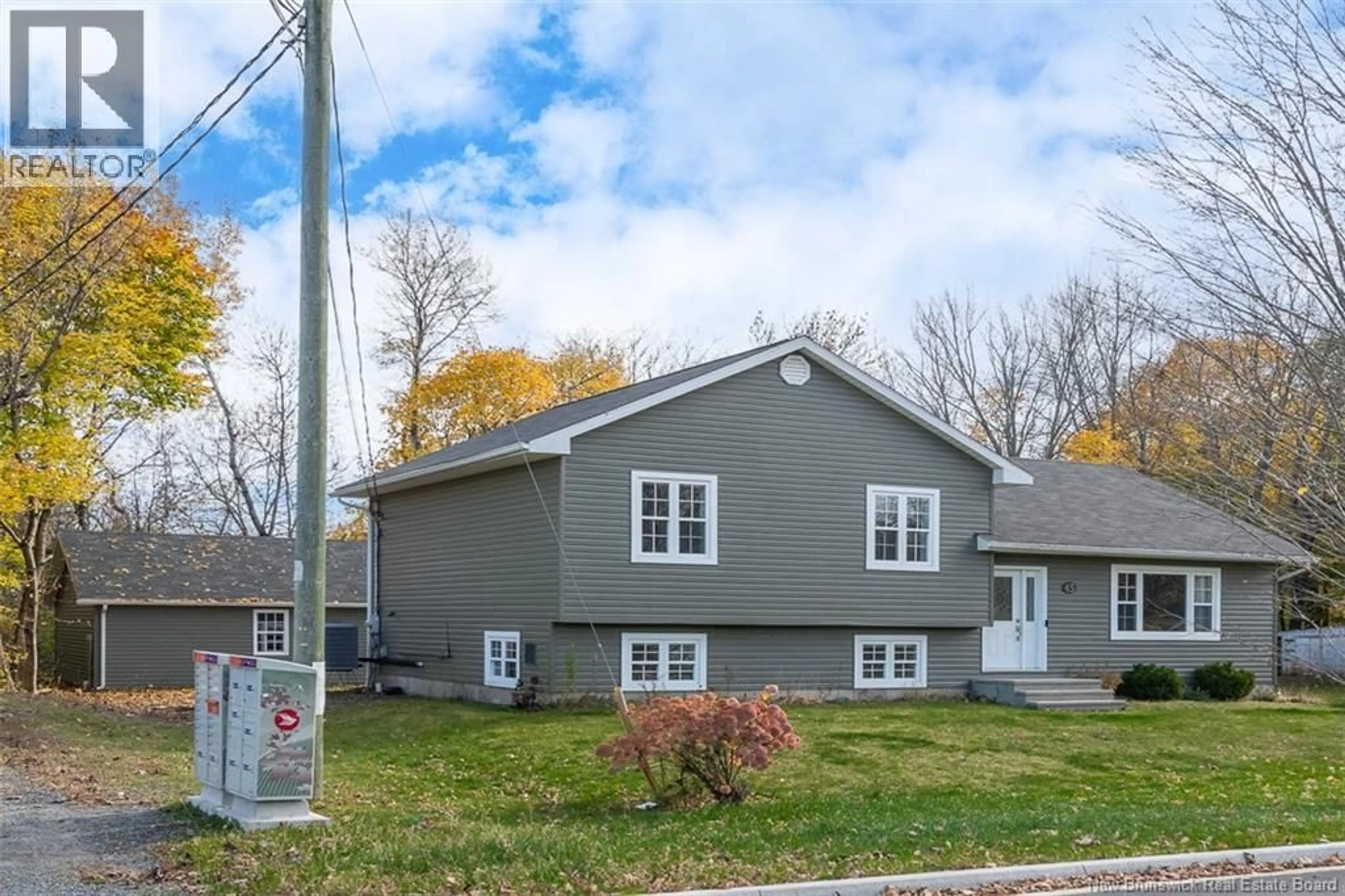 Home with vinyl exterior material, street for 65 AQUARIUS STREET, Fredericton New Brunswick E3B8P5