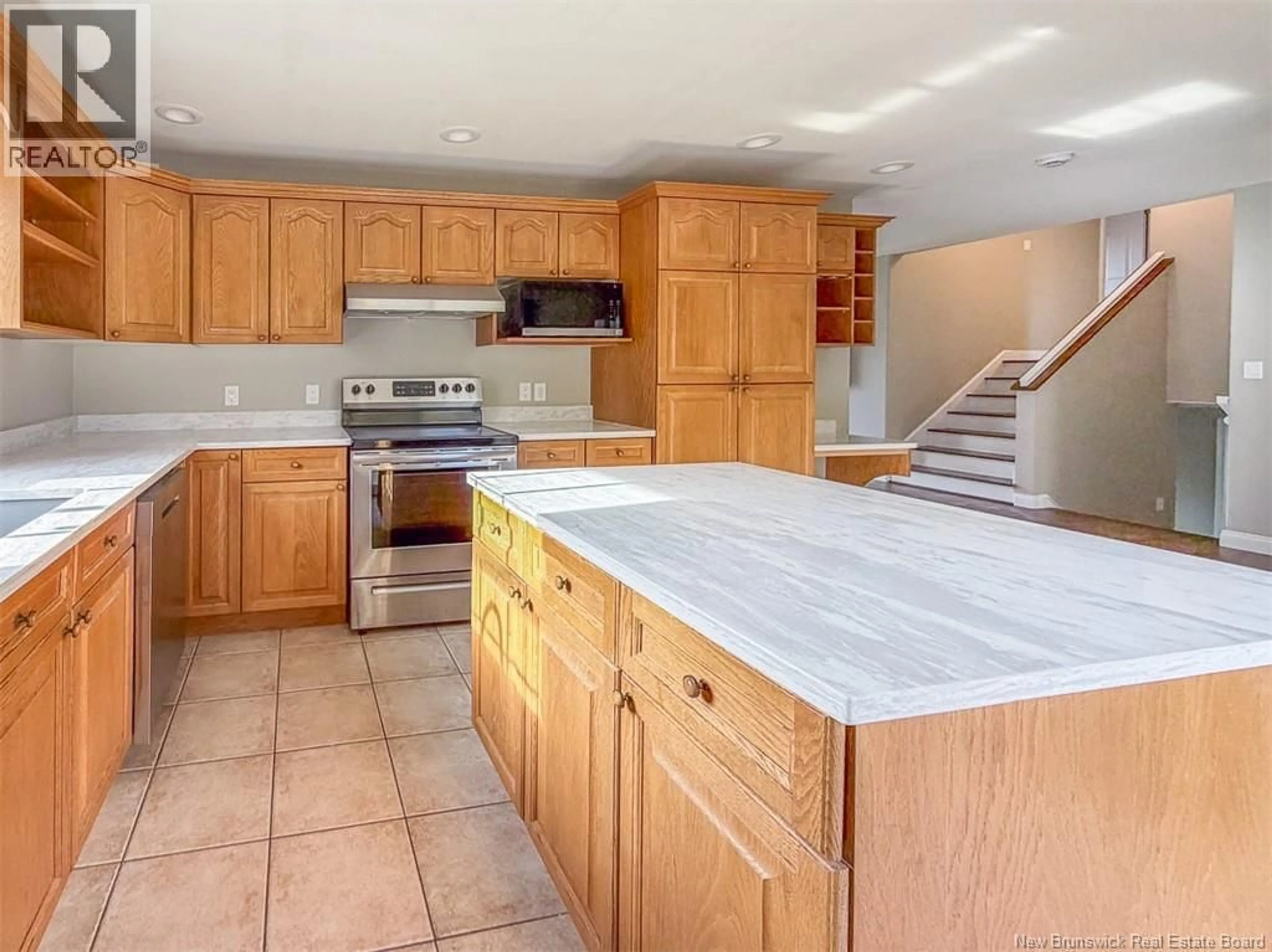 Open concept kitchen, ceramic/tile floor for 65 AQUARIUS STREET, Fredericton New Brunswick E3B8P5