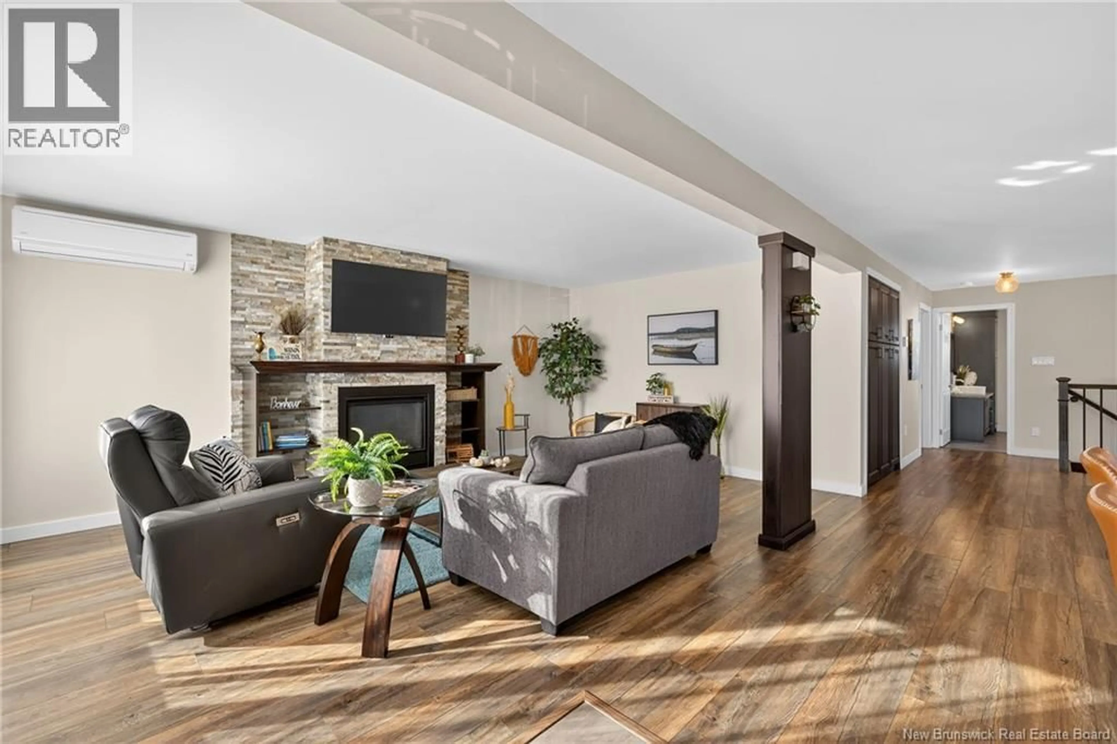 Living room with furniture, wood/laminate floor for 470 RUE ACADIE STREET, Grande-Anse New Brunswick E8N1E4