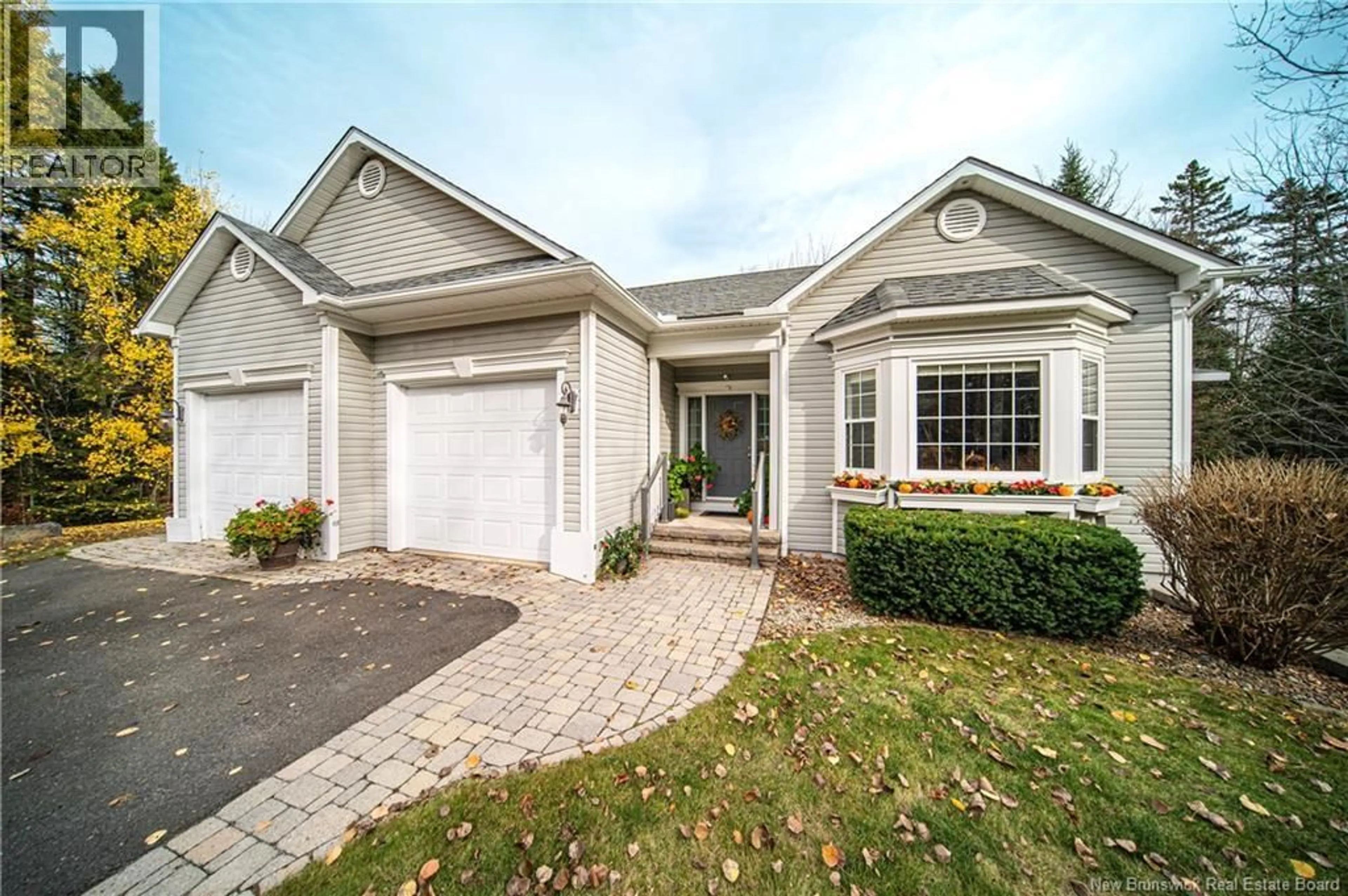 Home with vinyl exterior material, street for 200 DEERWOOD, Hanwell New Brunswick E3E1C1