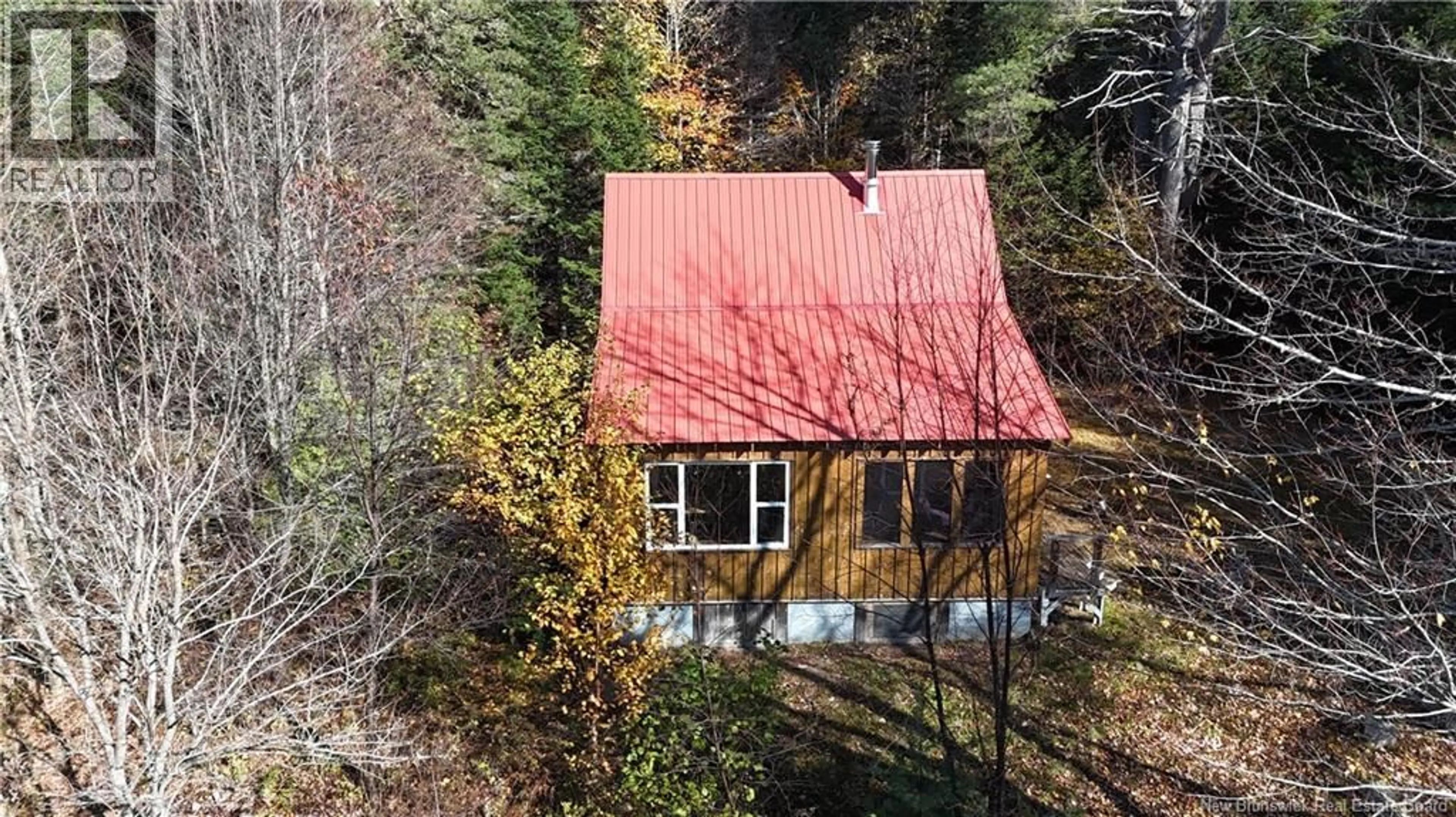 A pic from outside/outdoor area/front of a property/back of a property/a pic from drone, unknown for 92-5 LOON BAY ROAD, Saint James New Brunswick E5A1H8