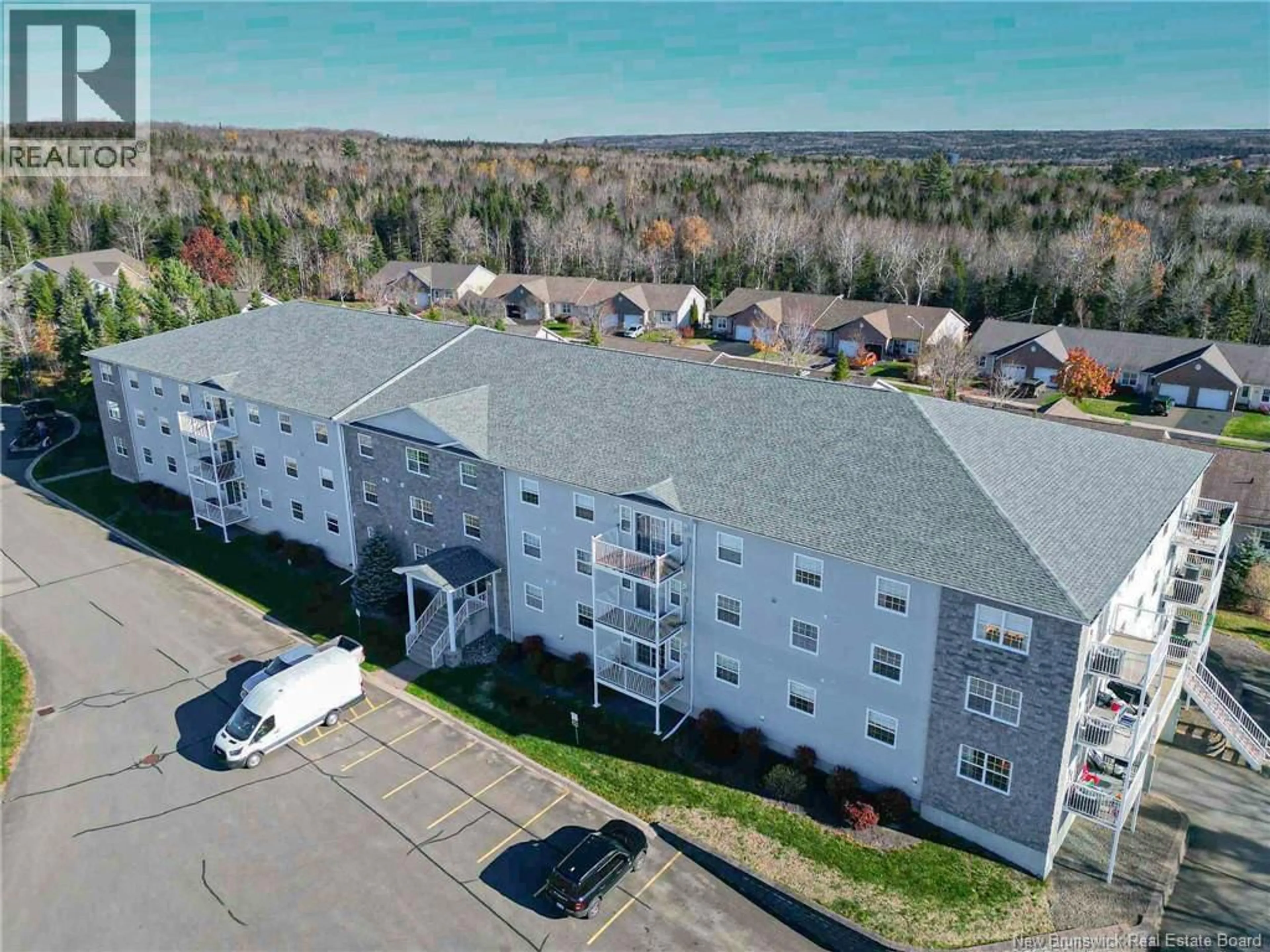 A pic from outside/outdoor area/front of a property/back of a property/a pic from drone, building for 105 - 40 BROWN BOULEVARD, Fredericton New Brunswick E3A0L7