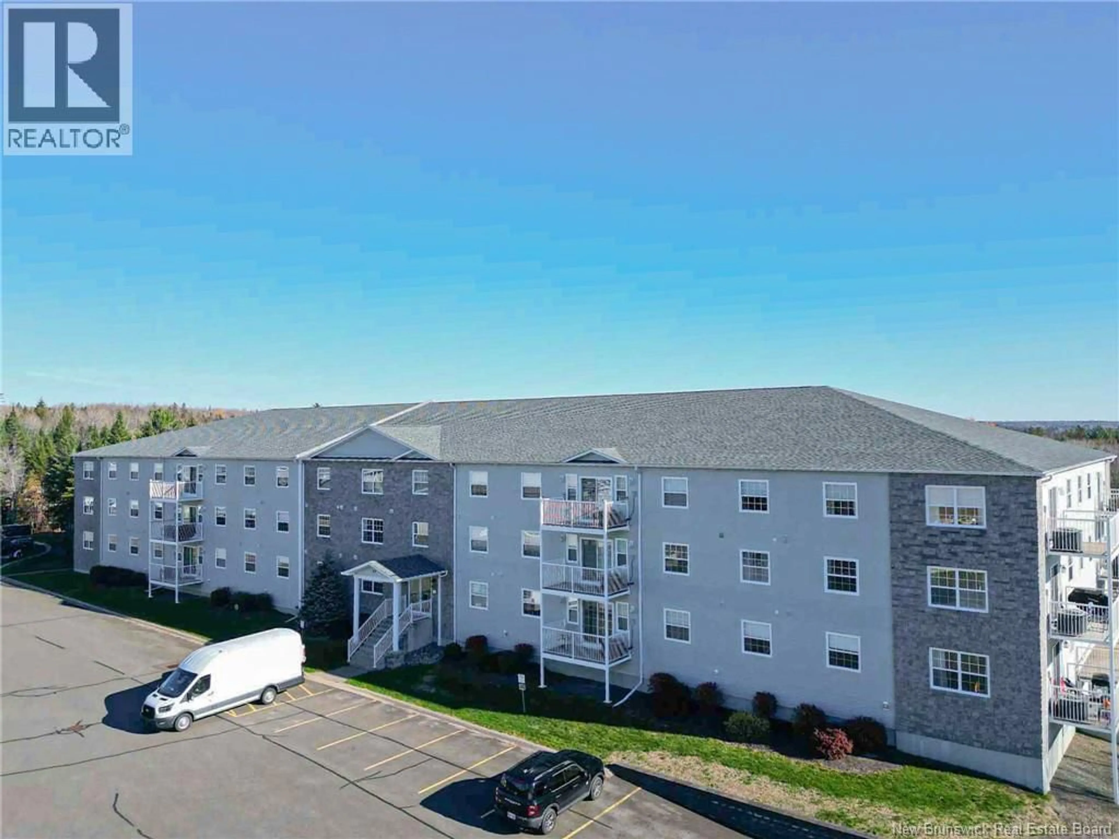 A pic from outside/outdoor area/front of a property/back of a property/a pic from drone, building for 105 - 40 BROWN BOULEVARD, Fredericton New Brunswick E3A0L7