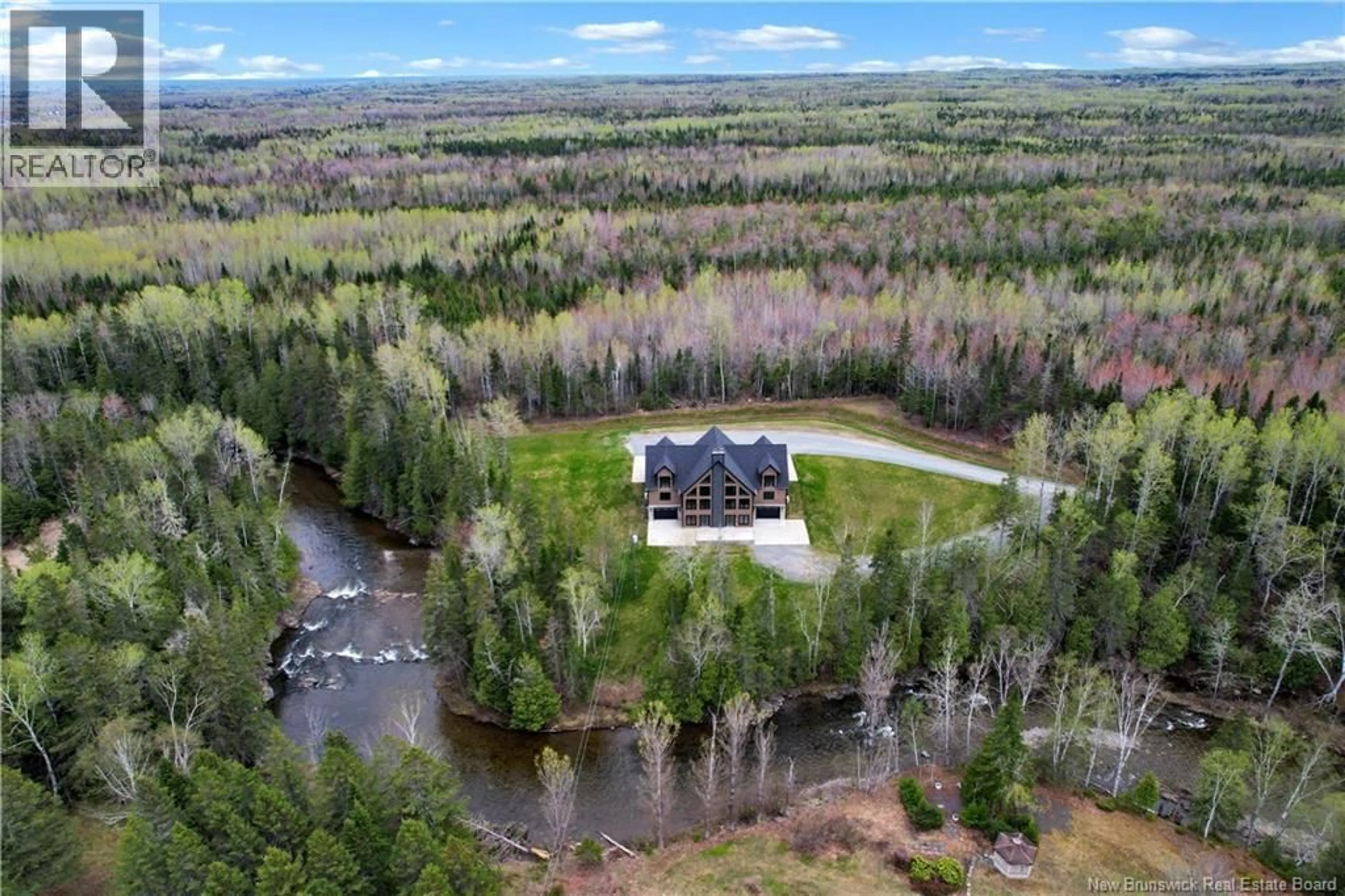 A pic from outside/outdoor area/front of a property/back of a property/a pic from drone, water/lake/river/ocean view for 15 ISRAËL LANE, Beresford New Brunswick E8K0C9