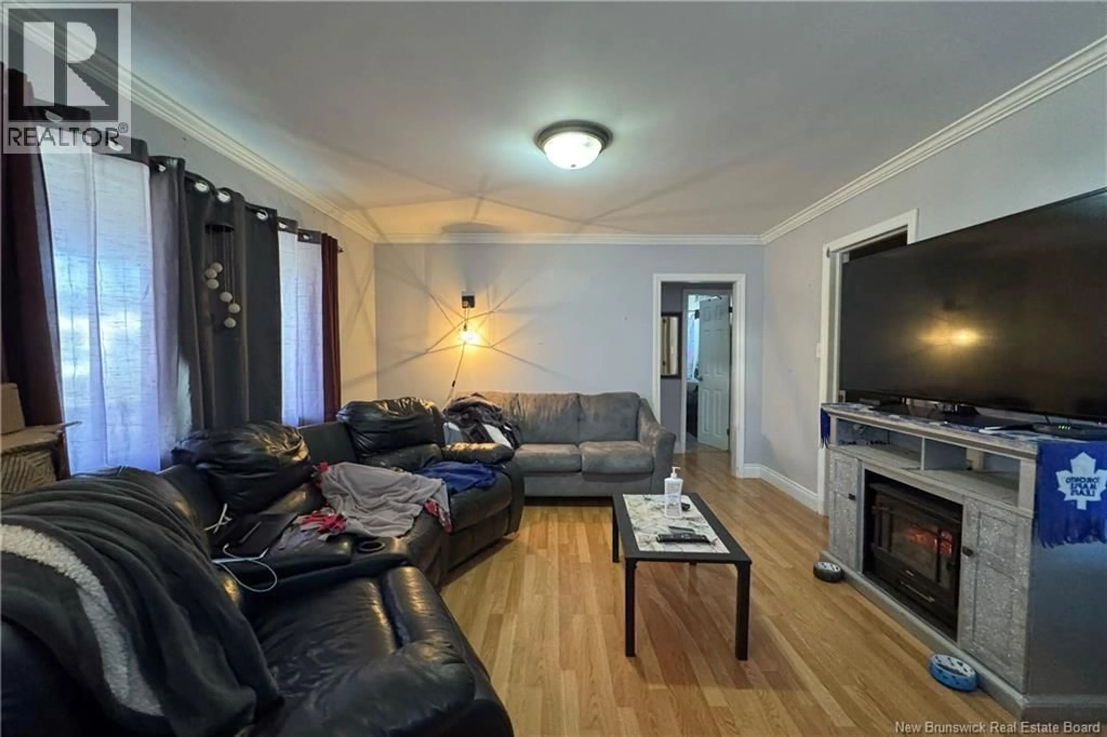 Living room with furniture, wood/laminate floor for 128 YORK STREET, Sackville New Brunswick E4L4S1