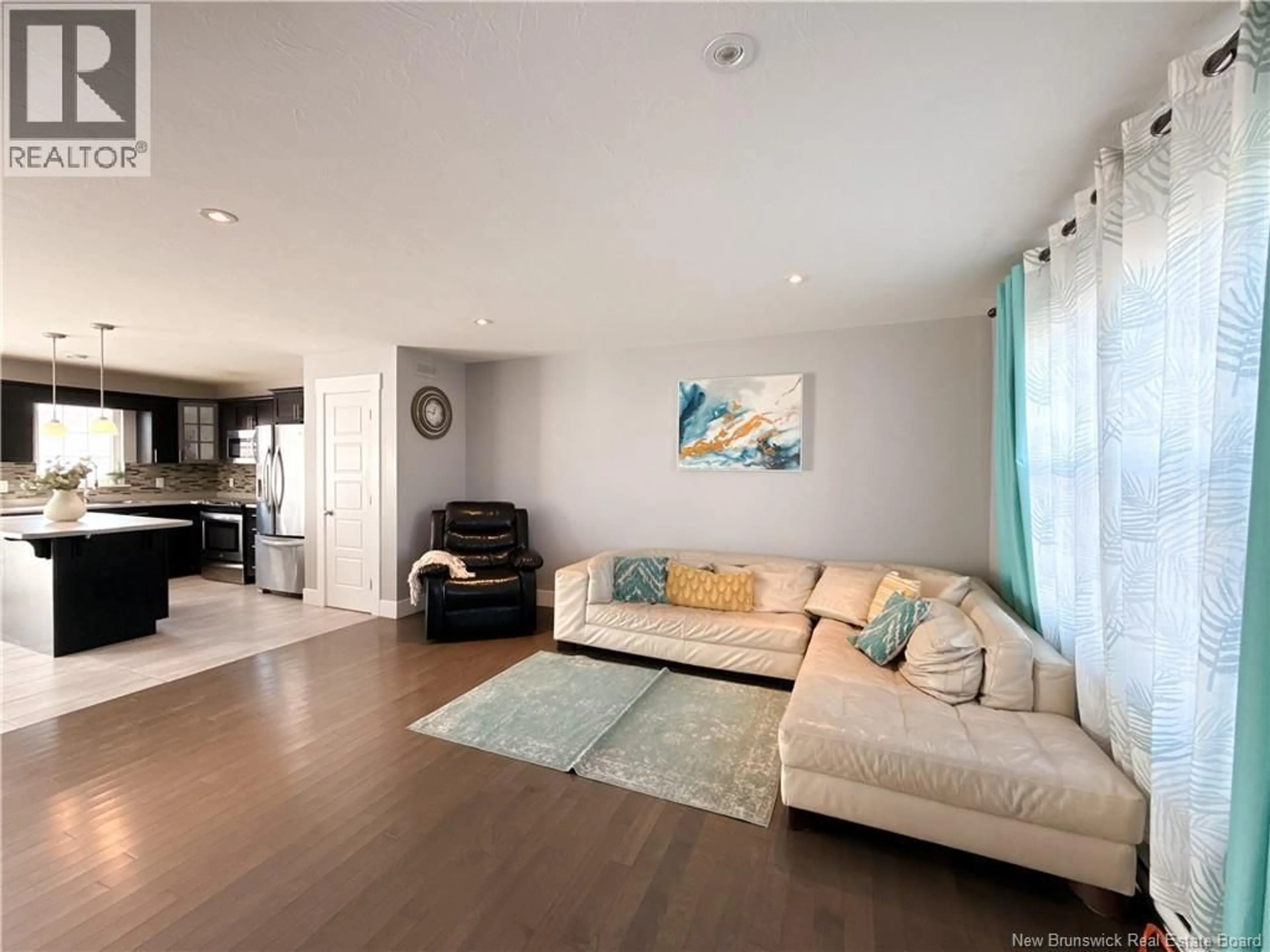 Living room with furniture, wood/laminate floor for 70 GAMBIA, Moncton New Brunswick E1G5K7