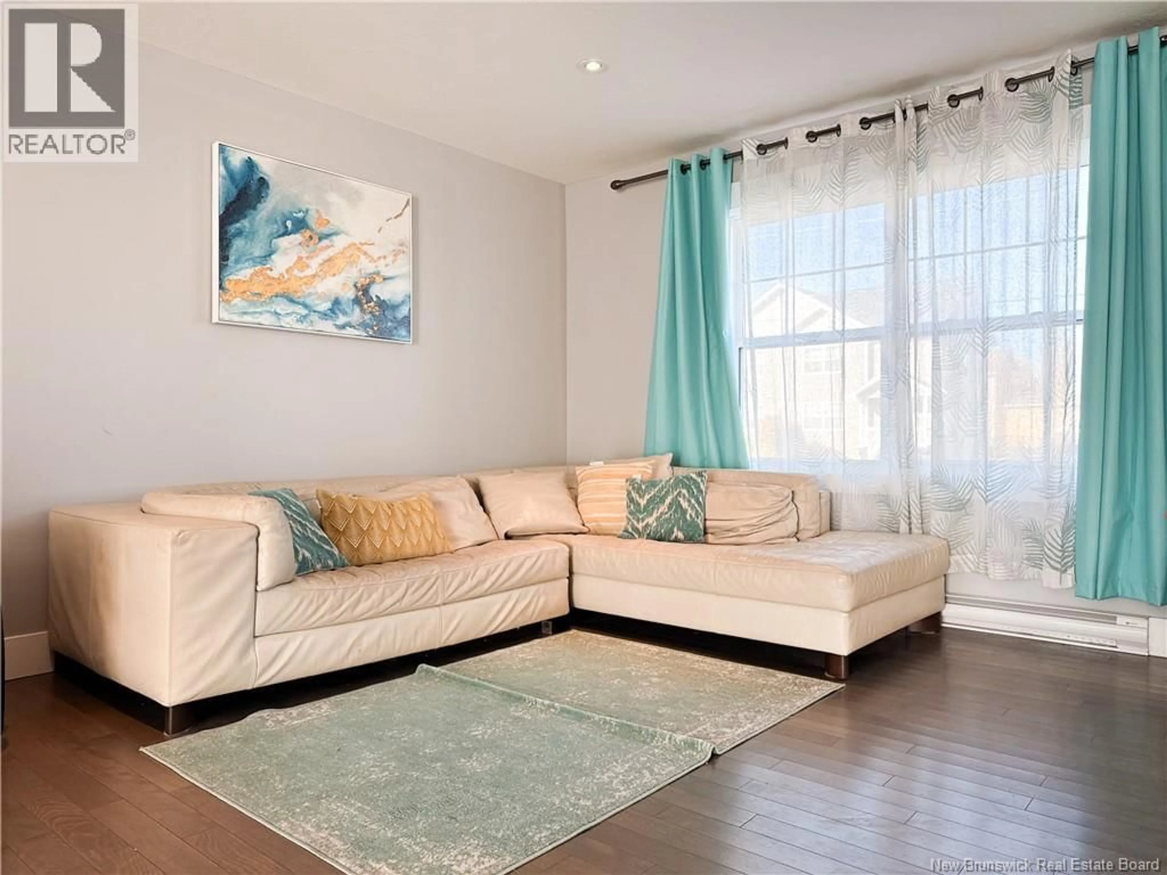 Living room with furniture, wood/laminate floor for 70 GAMBIA, Moncton New Brunswick E1G5K7