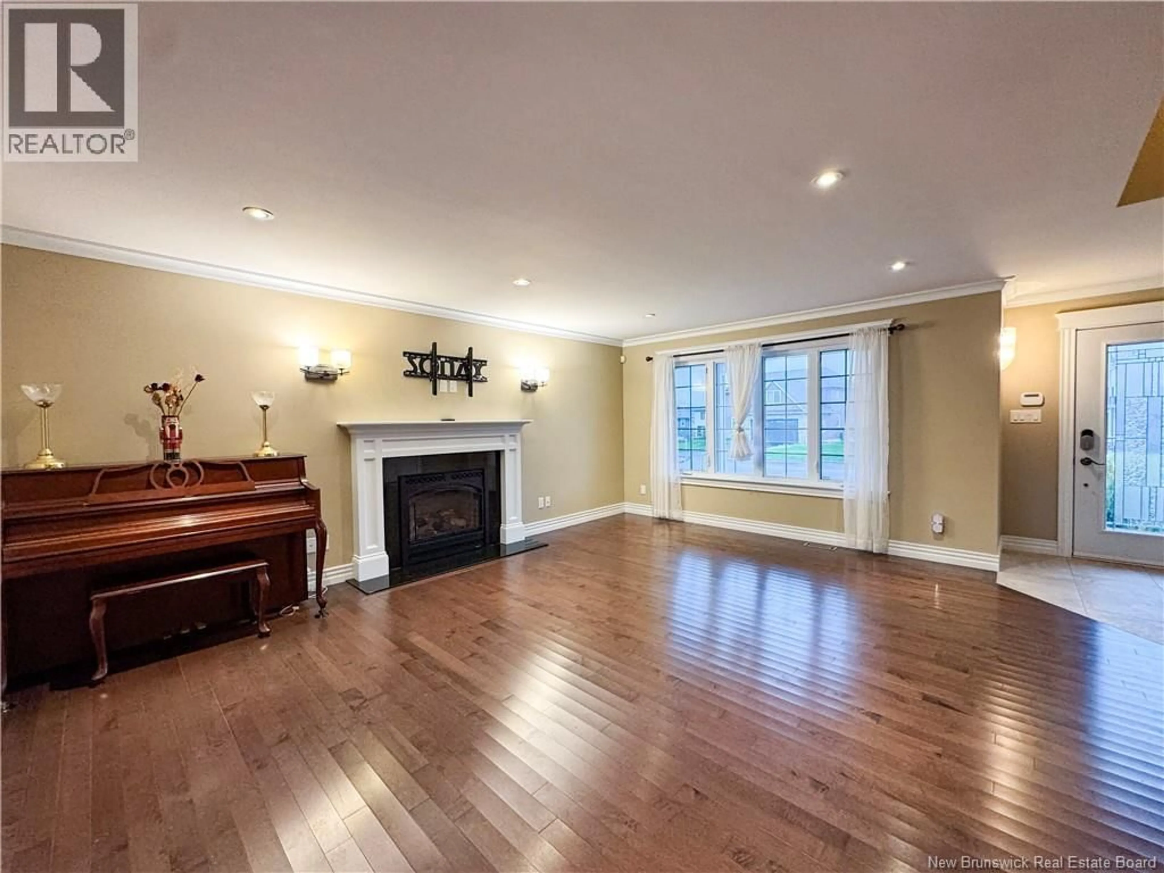 Living room with furniture, wood/laminate floor for 145 AMIENS DRIVE, Moncton New Brunswick E1G5R5