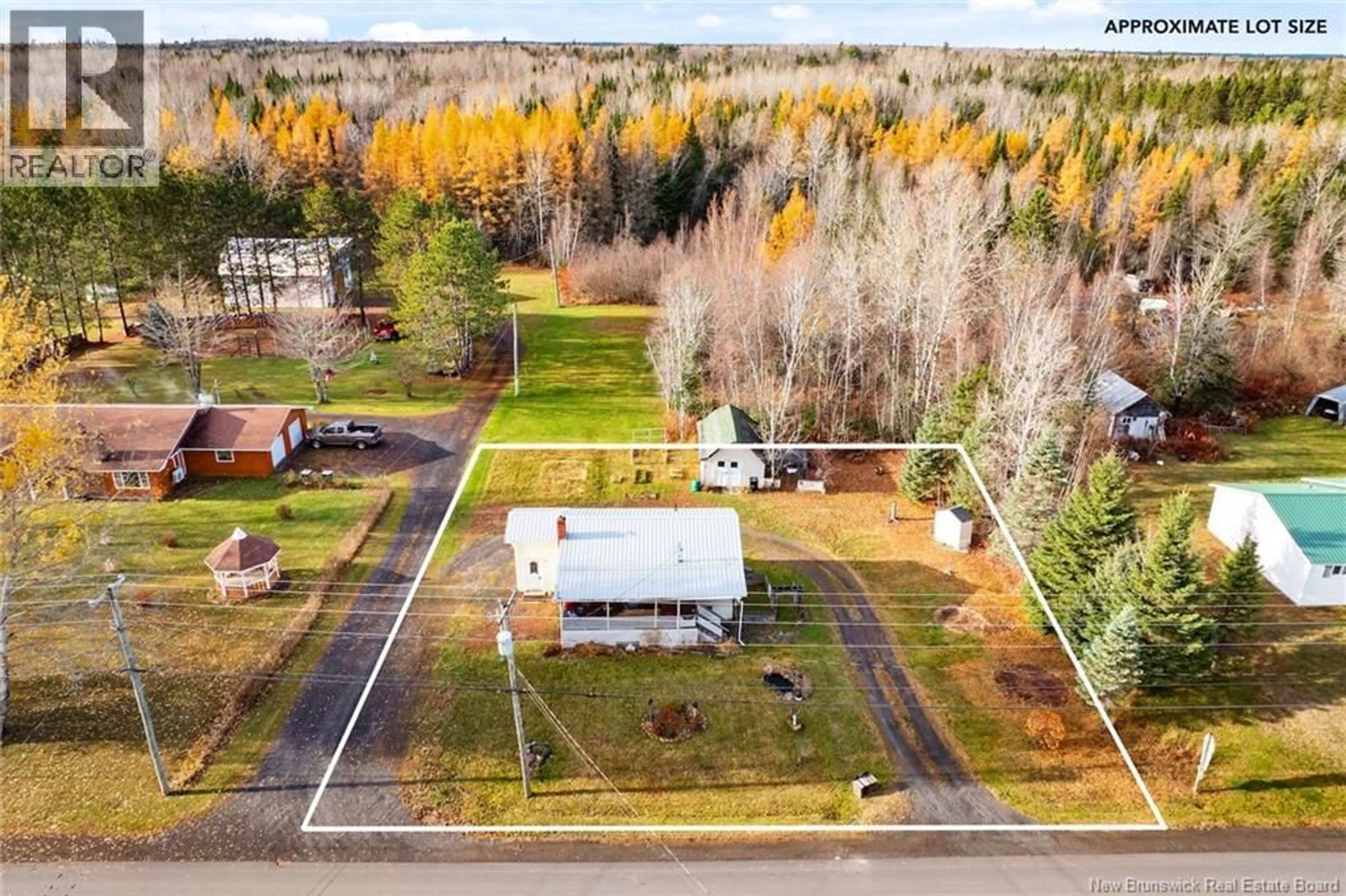 A pic from outside/outdoor area/front of a property/back of a property/a pic from drone, unknown for 32 PLEASANT DRIVE, Chipman New Brunswick E4A1S3