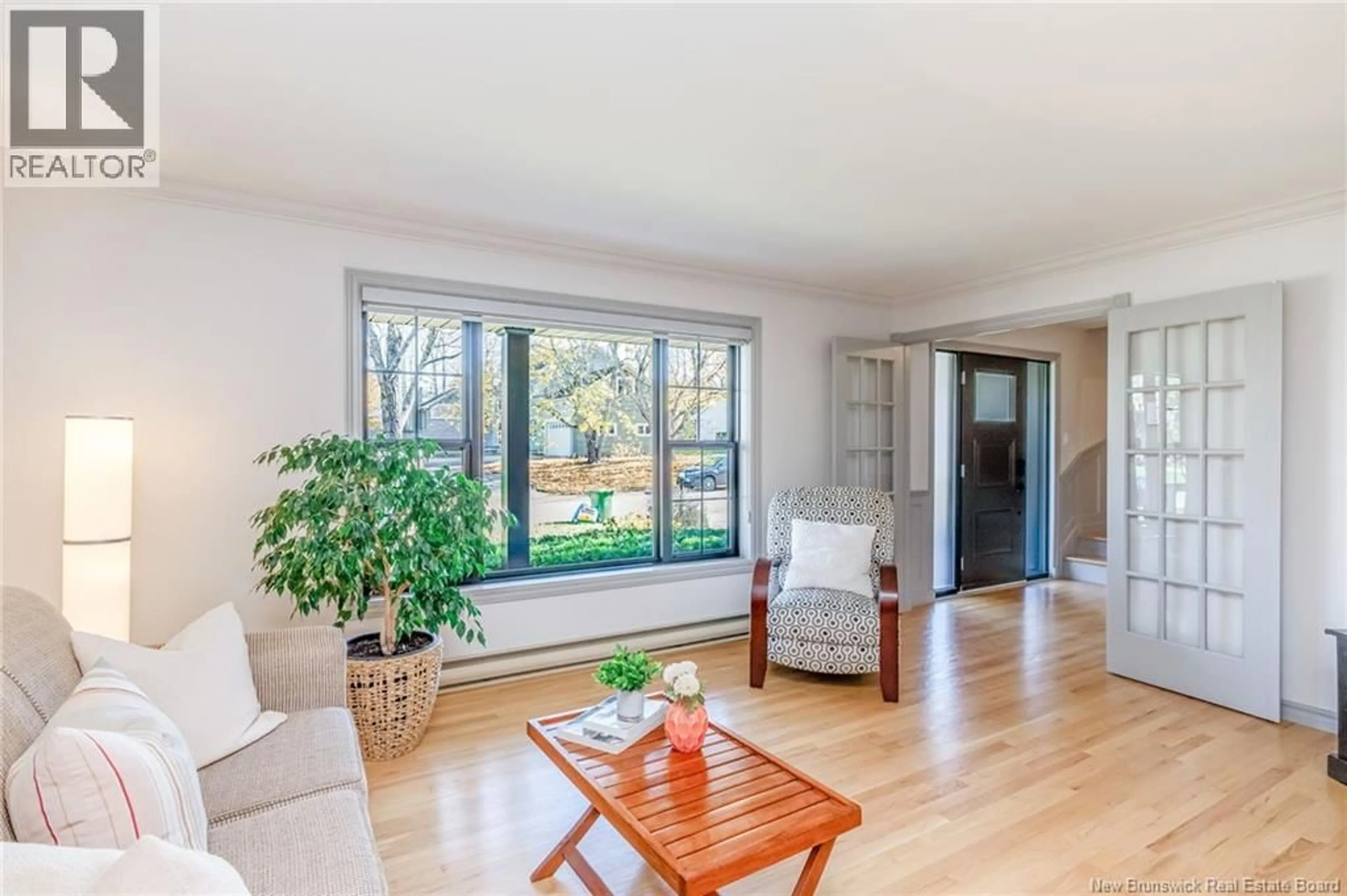 Living room with furniture, wood/laminate floor for 77 FAIRWAY, Riverview New Brunswick E1B4K8