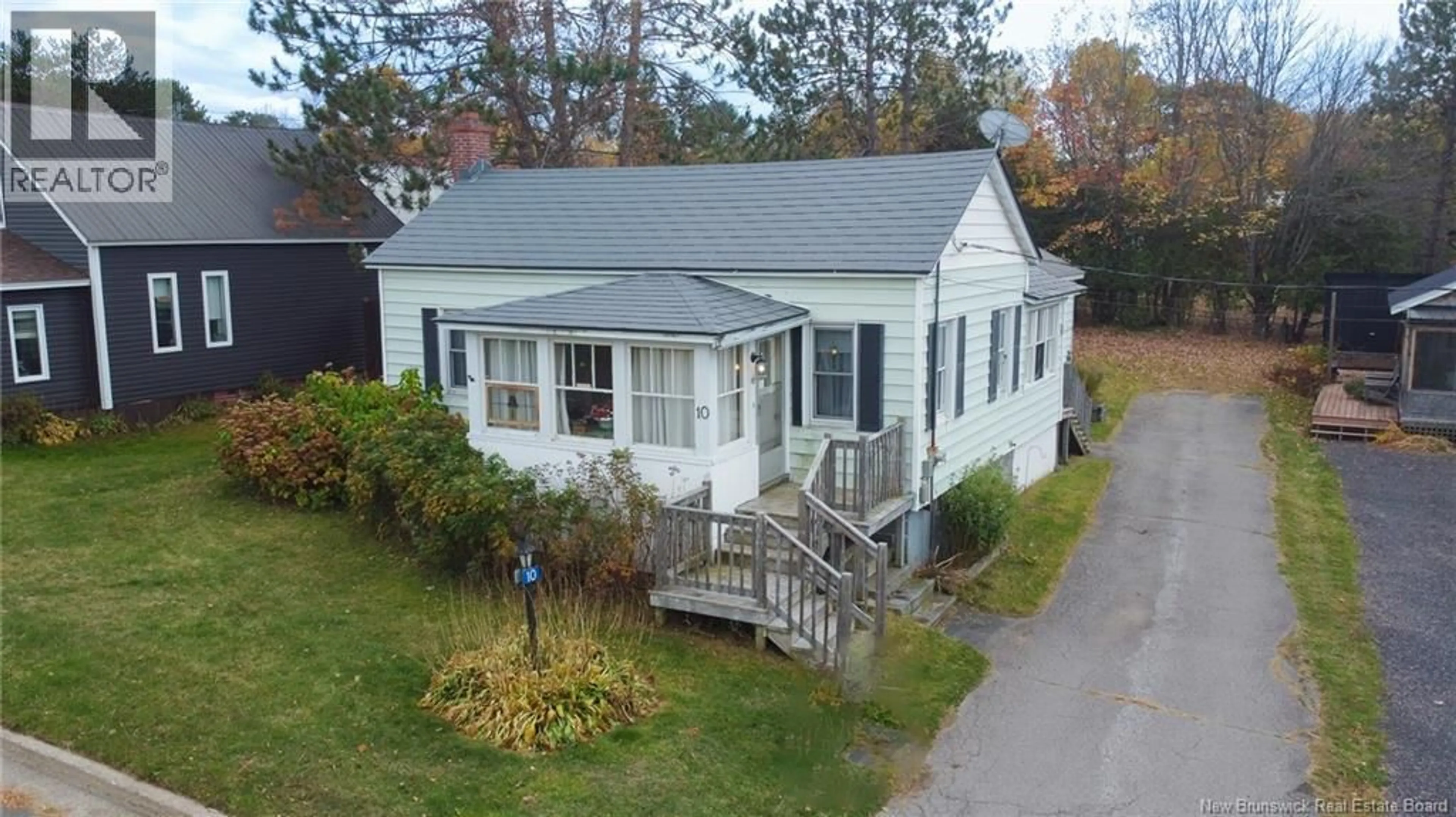A pic from outside/outdoor area/front of a property/back of a property/a pic from drone, street for 10 HILLCREST AVENUE, Chipman New Brunswick E4A1X9