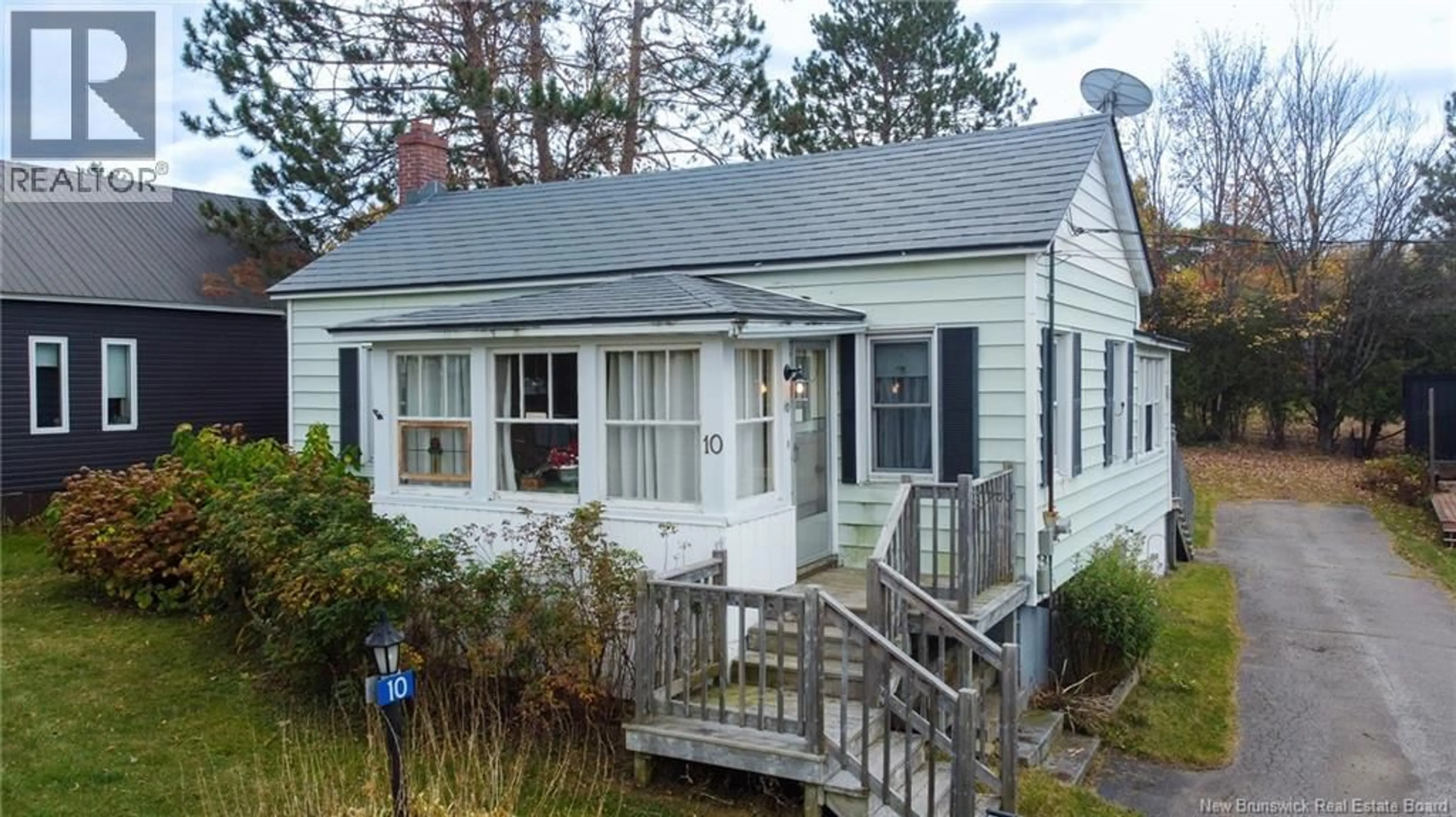 Home with vinyl exterior material, street for 10 HILLCREST AVENUE, Chipman New Brunswick E4A1X9