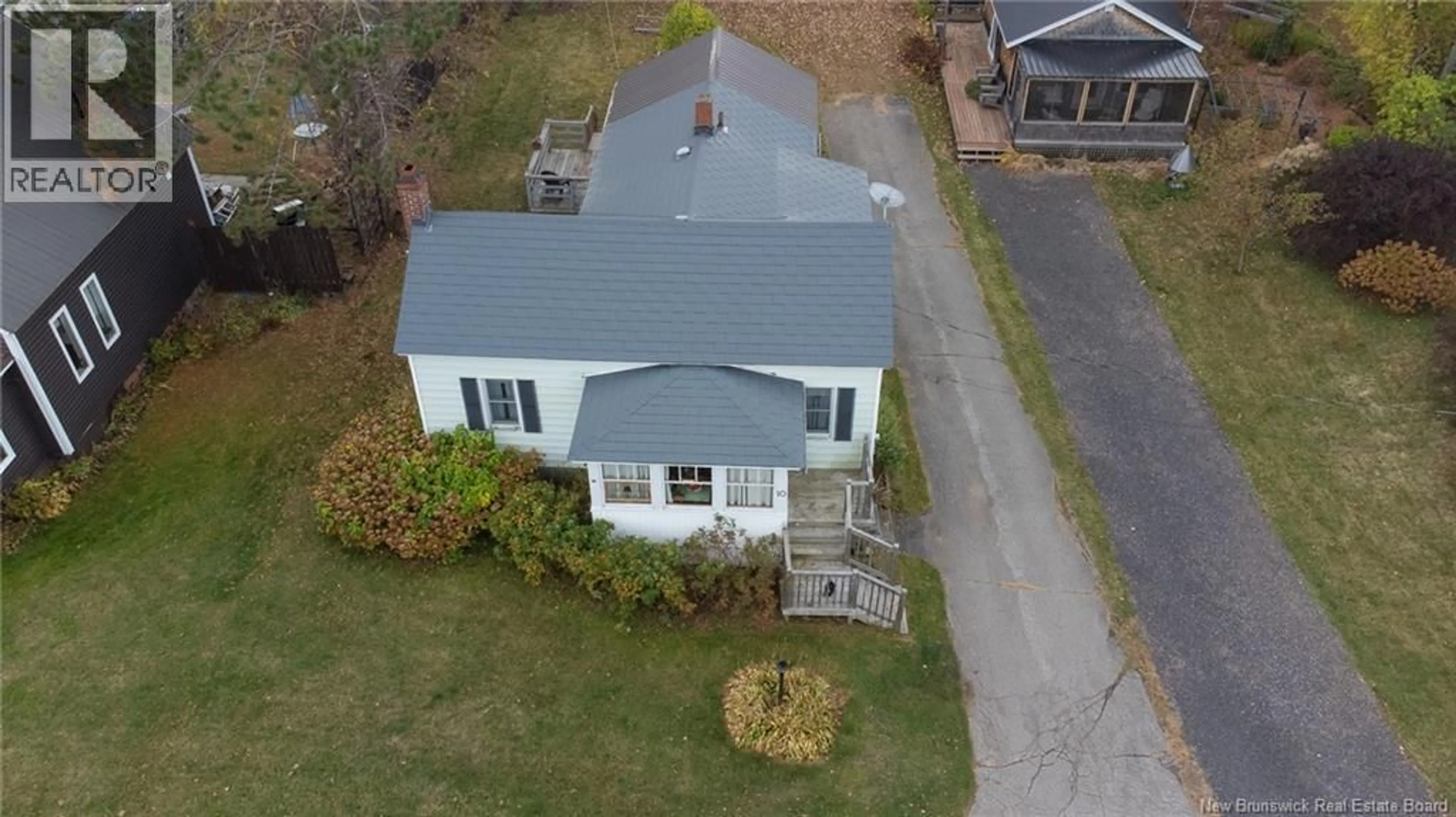 A pic from outside/outdoor area/front of a property/back of a property/a pic from drone, building for 10 HILLCREST AVENUE, Chipman New Brunswick E4A1X9