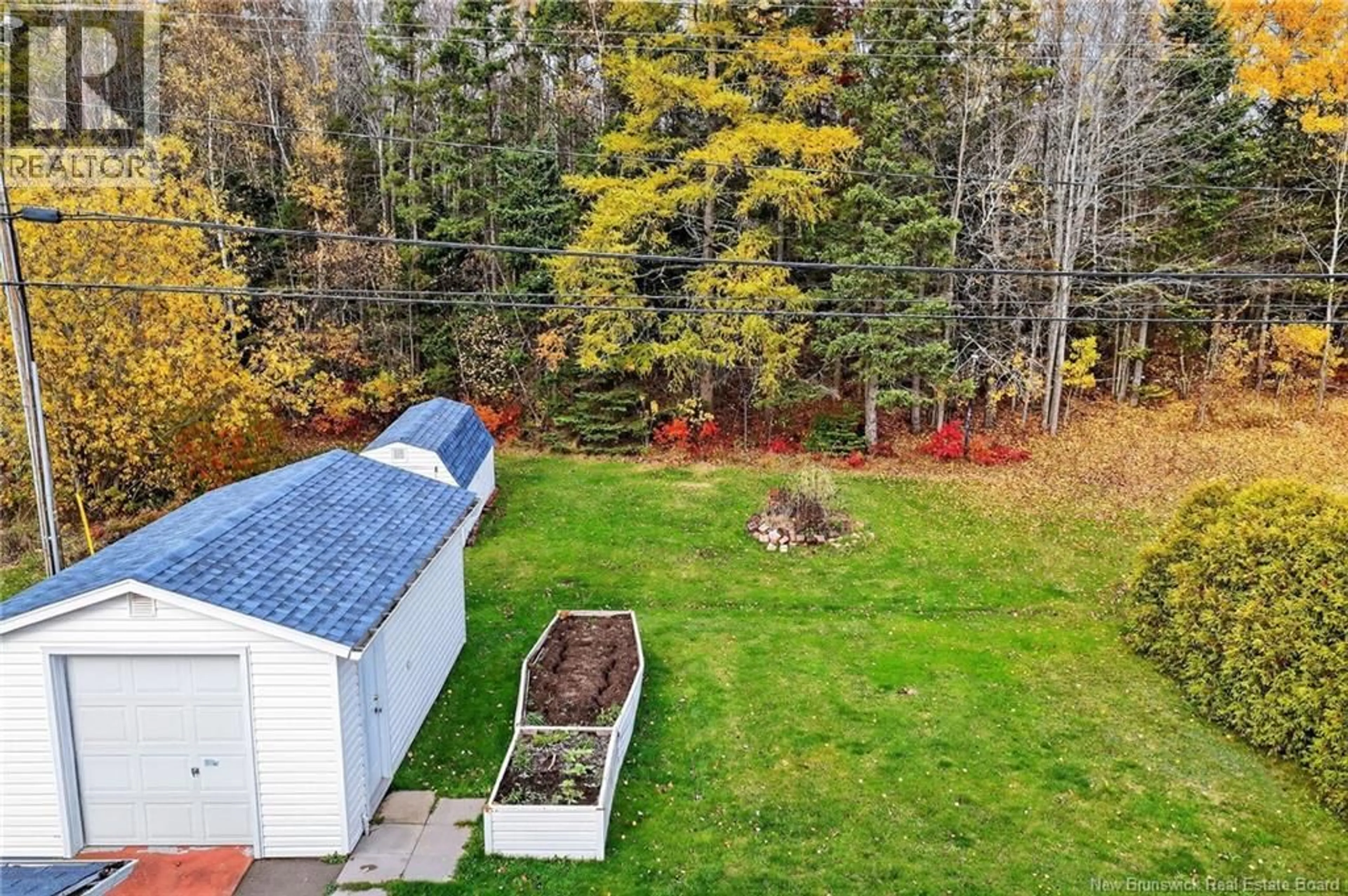 A pic from outside/outdoor area/front of a property/back of a property/a pic from drone, forest/trees view for 103 LABROSSE, Moncton New Brunswick E1A4W9