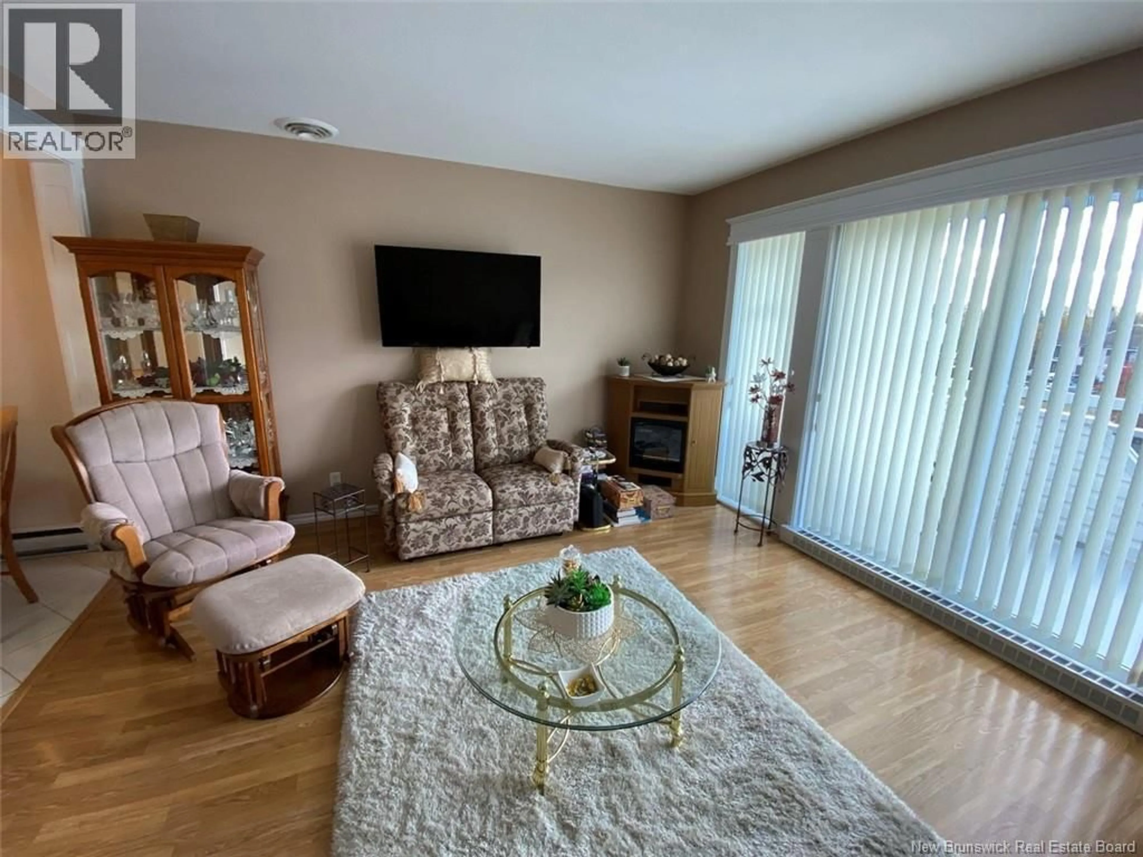 Living room with furniture, wood/laminate floor for 20 DU BOURG AVENUE, Edmundston New Brunswick E3V4C5