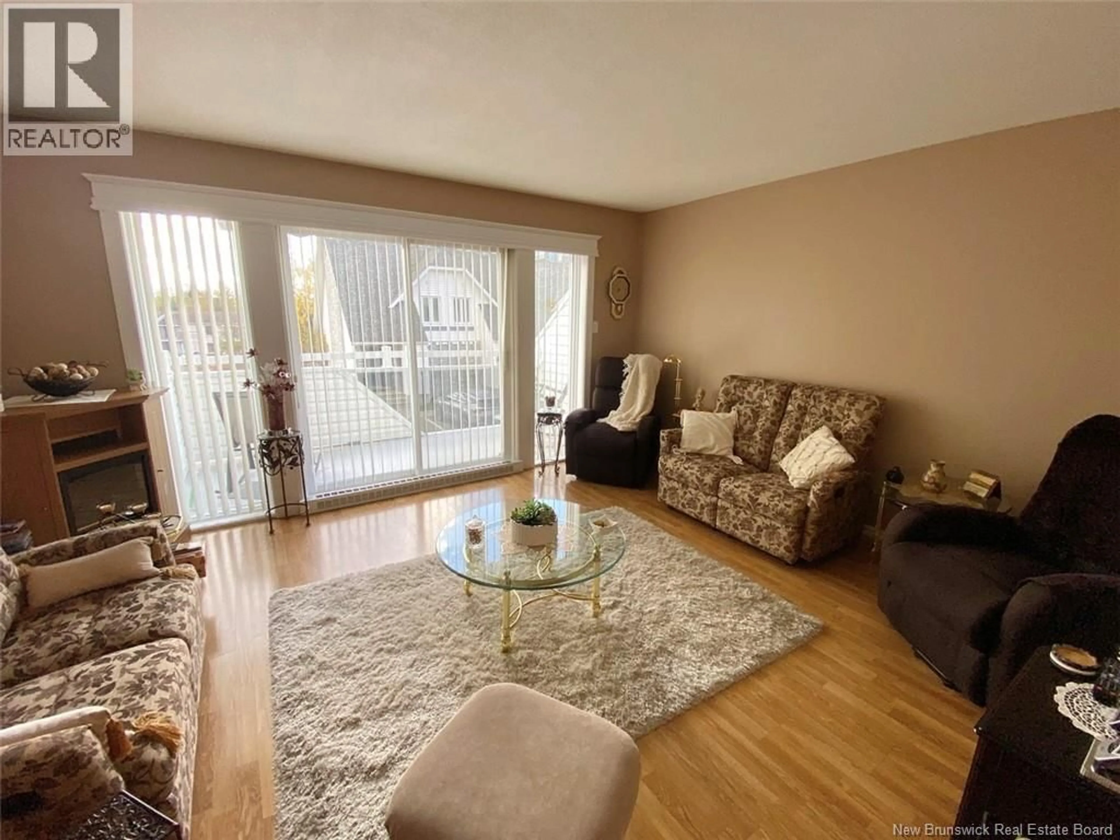 Living room with furniture, wood/laminate floor for 20 DU BOURG AVENUE, Edmundston New Brunswick E3V4C5
