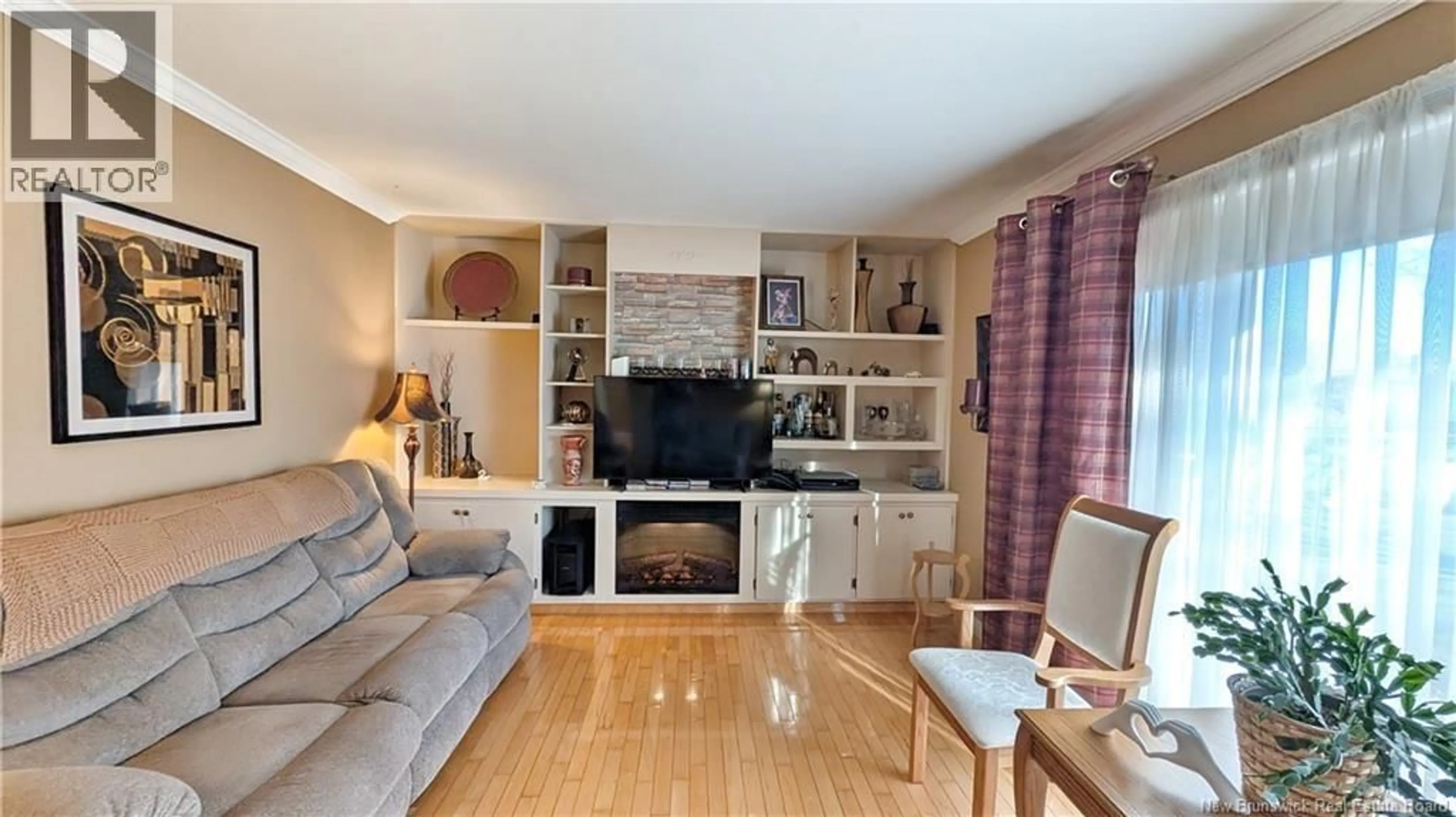 Living room with furniture, wood/laminate floor for 78 RUE RIOUX STREET, Saint-Isidore New Brunswick E8M1G1