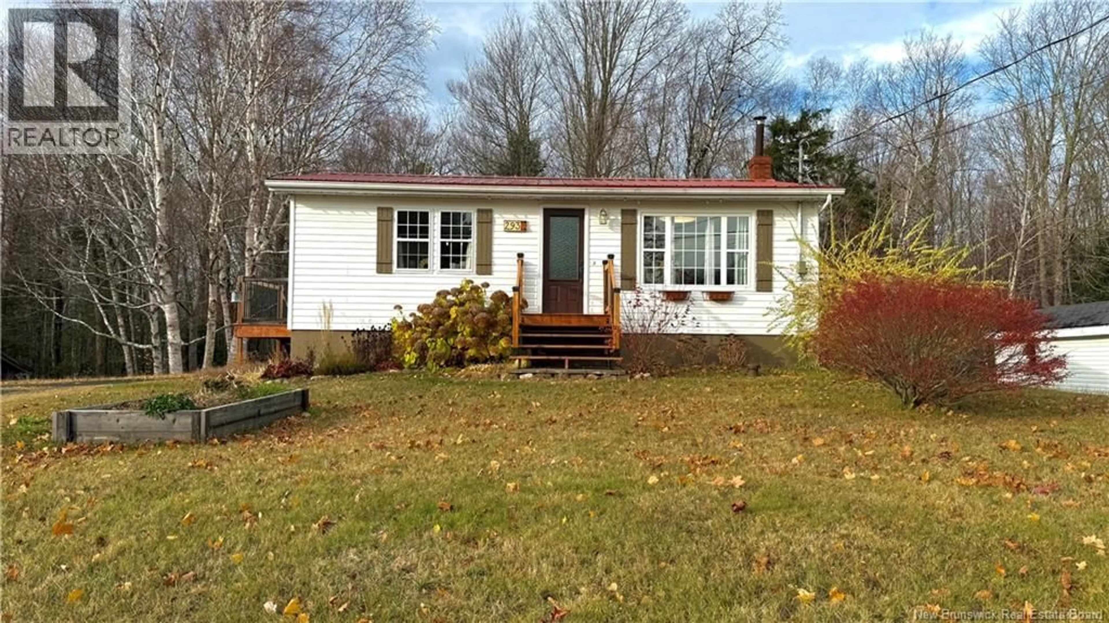 Home with vinyl exterior material, street for 293 CH COLLETTE, Collette New Brunswick E4Y1J3