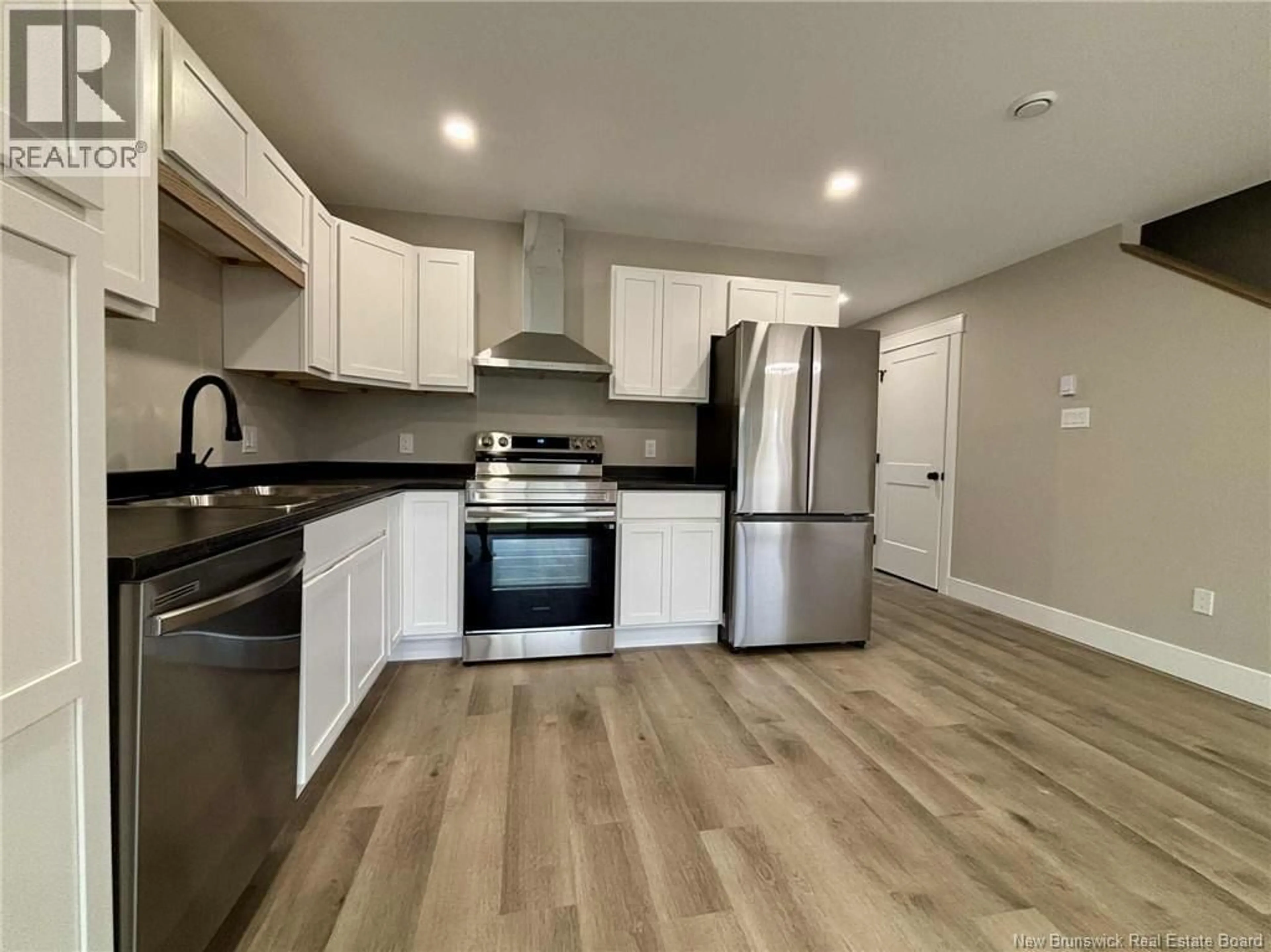 Open concept kitchen, wood/laminate floor for 177 ARLINGTON CRESCENT, Saint John New Brunswick E2K0G4