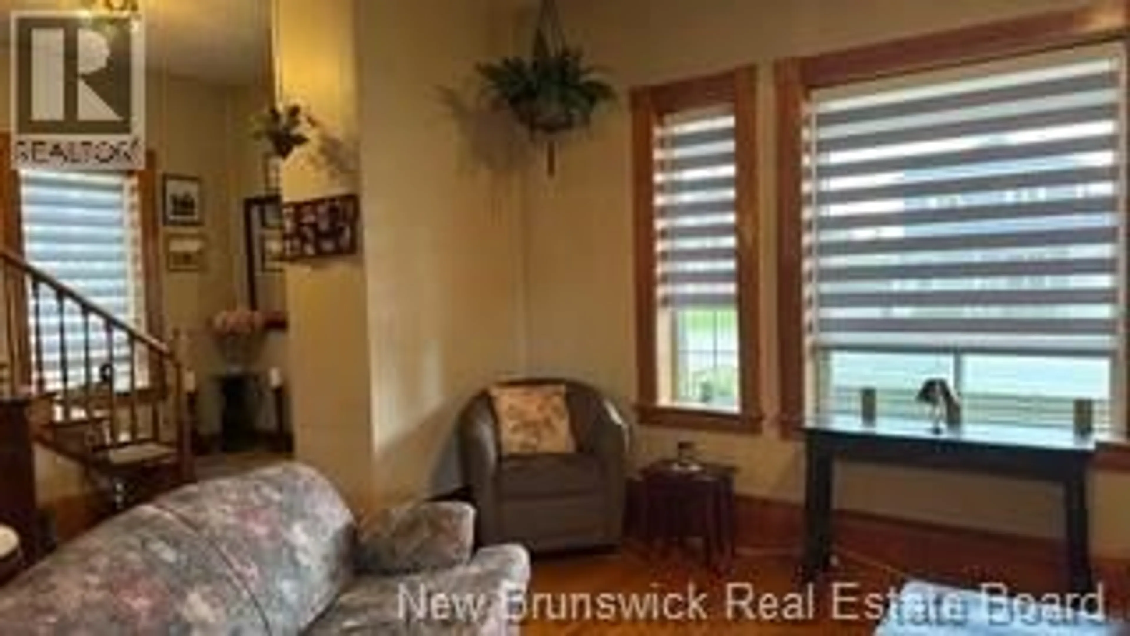 Living room with furniture, wood/laminate floor for 22 CYR STREET, Saint-Léonard New Brunswick E7E1X7