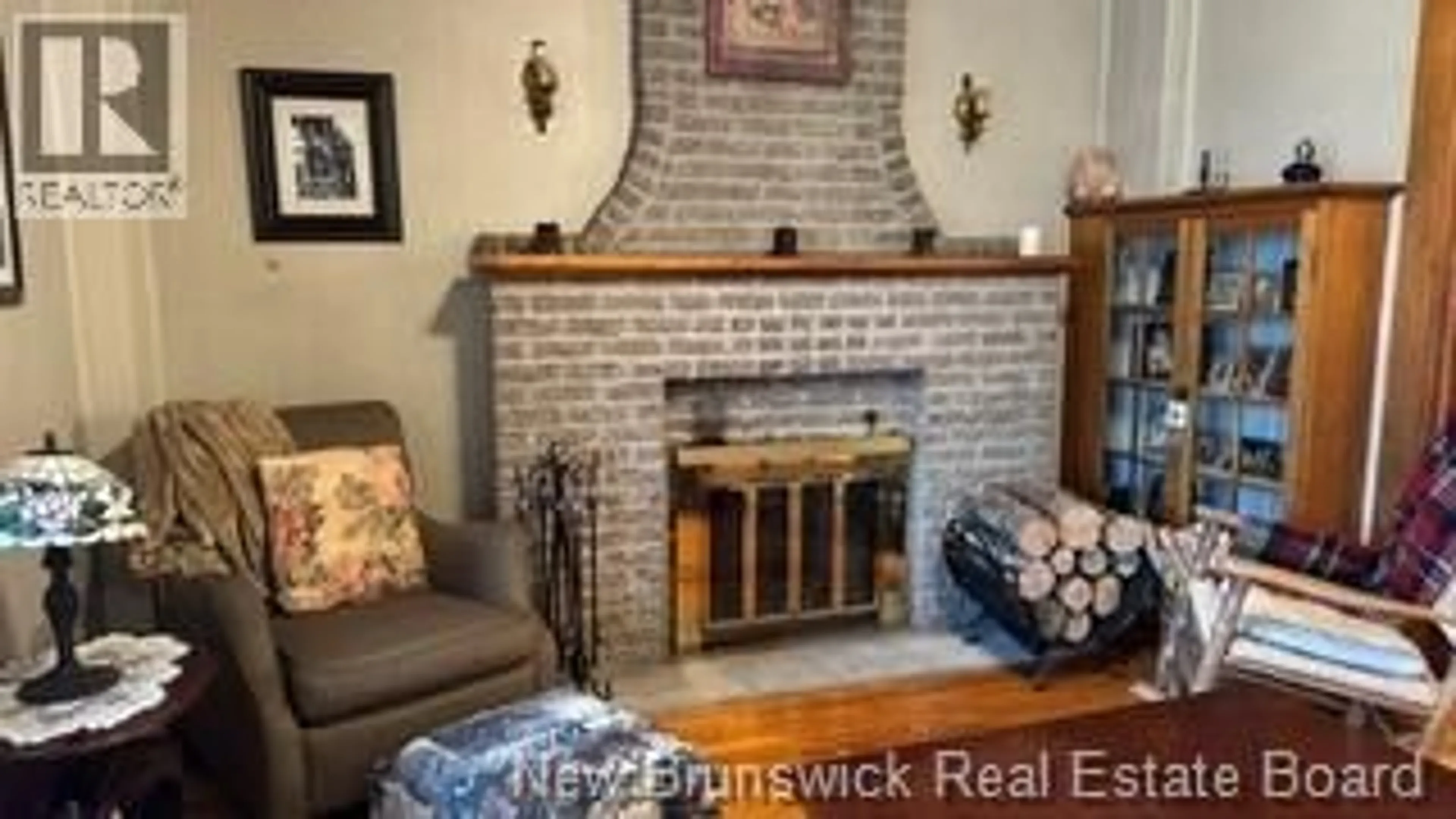 Living room with furniture, wood/laminate floor for 22 CYR STREET, Saint-Léonard New Brunswick E7E1X7