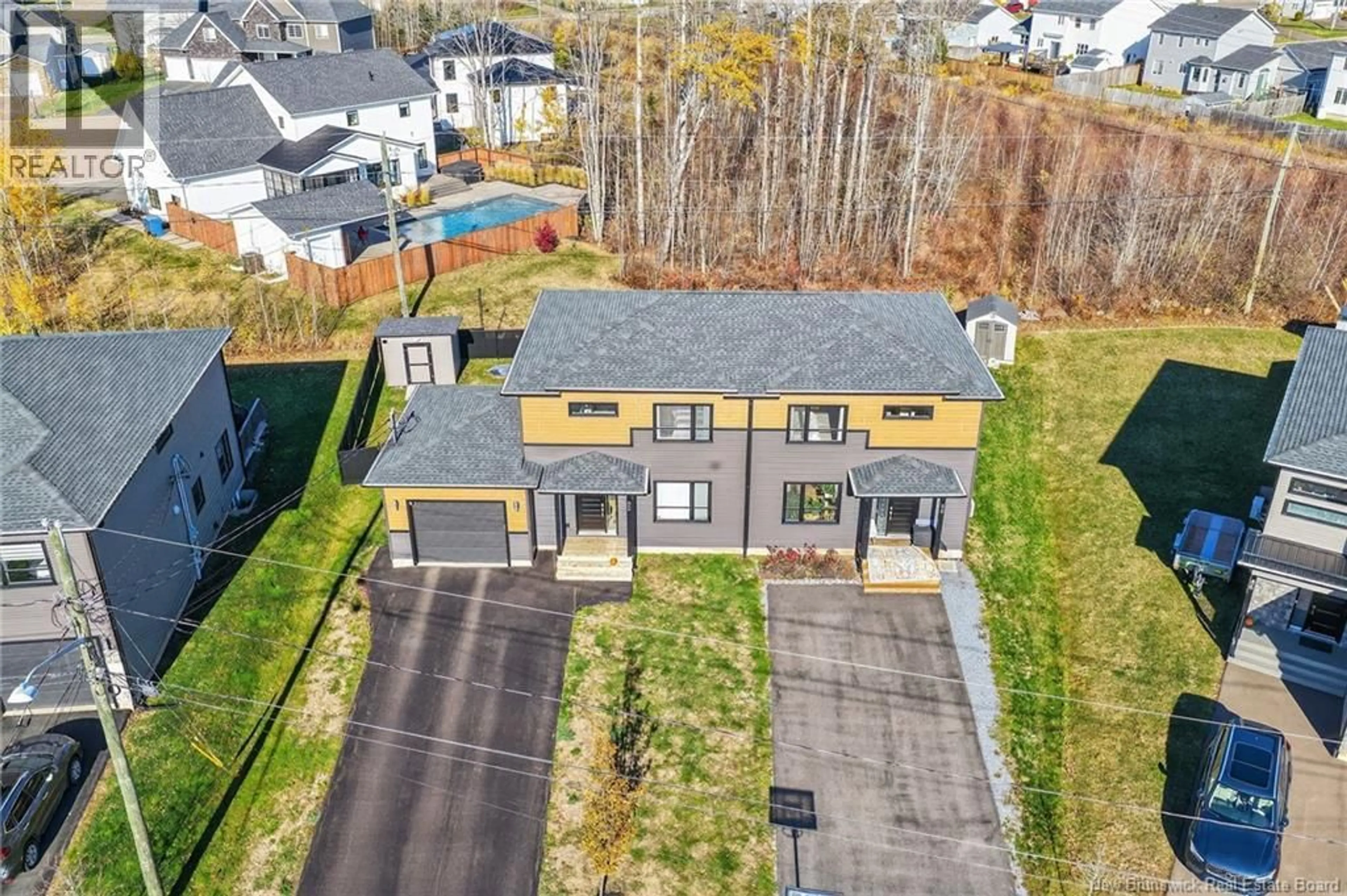 A pic from outside/outdoor area/front of a property/back of a property/a pic from drone, street for 92 TIMANDRA, Moncton New Brunswick E1G5Y4