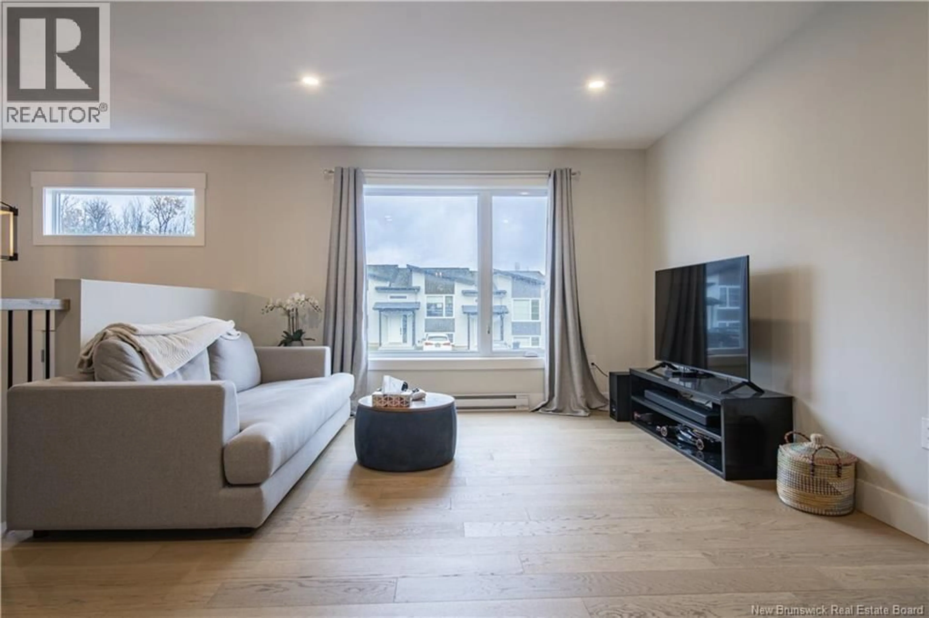 Living room with furniture, wood/laminate floor for 126 DONAT CRESCENT, Dieppe New Brunswick E1A9L4