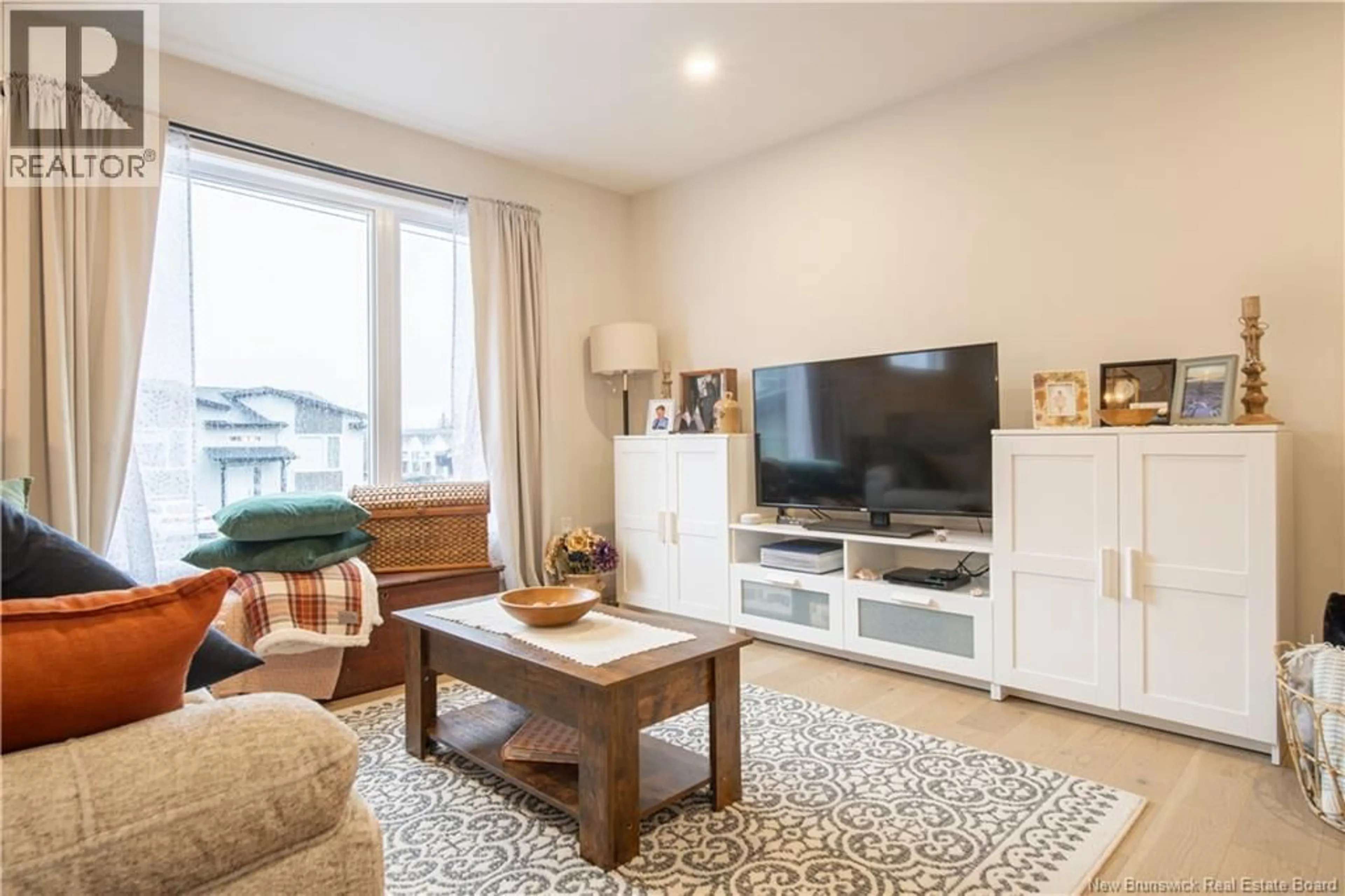 Living room with furniture, wood/laminate floor for 128 DONAT CRESCENT, Dieppe New Brunswick E1A9L4