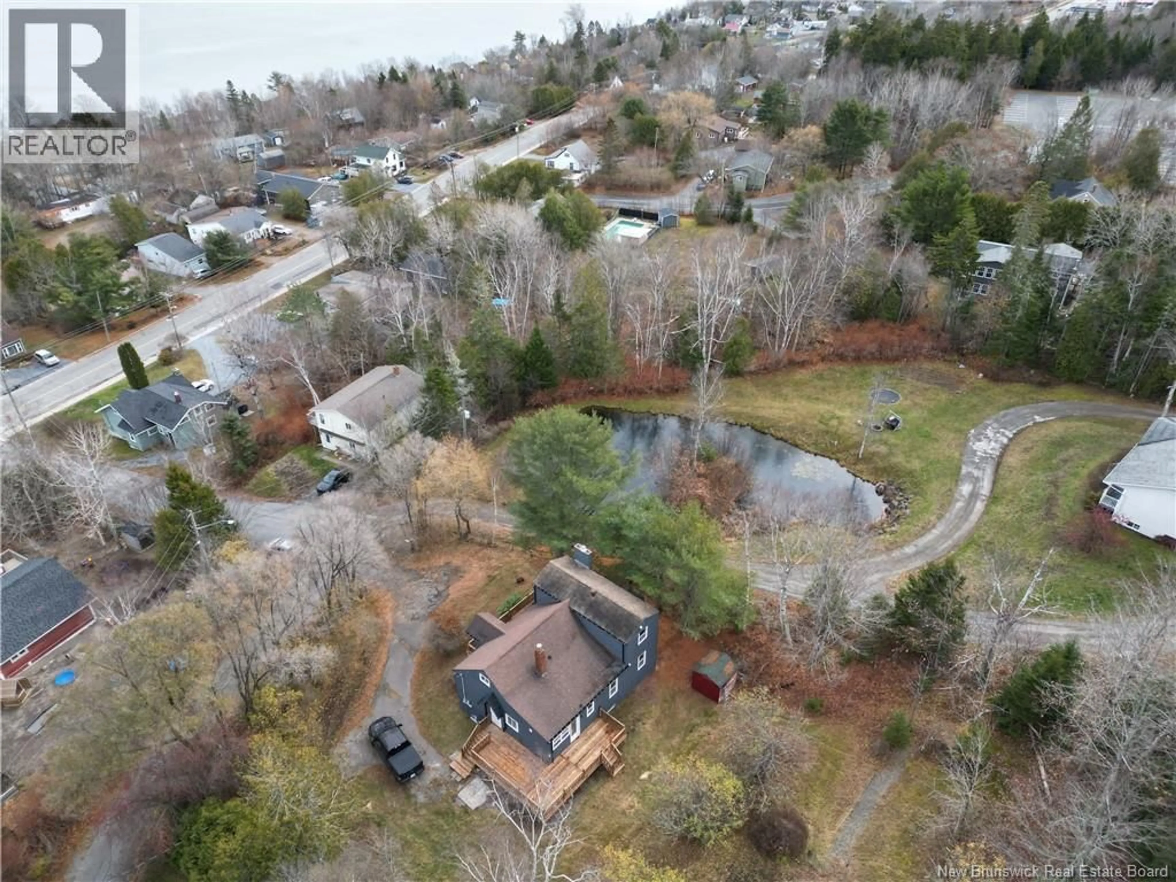 A pic from outside/outdoor area/front of a property/back of a property/a pic from drone, water/lake/river/ocean view for 31 LAKEVIEW ROAD, Grand Bay-Westfield New Brunswick E5K1V2