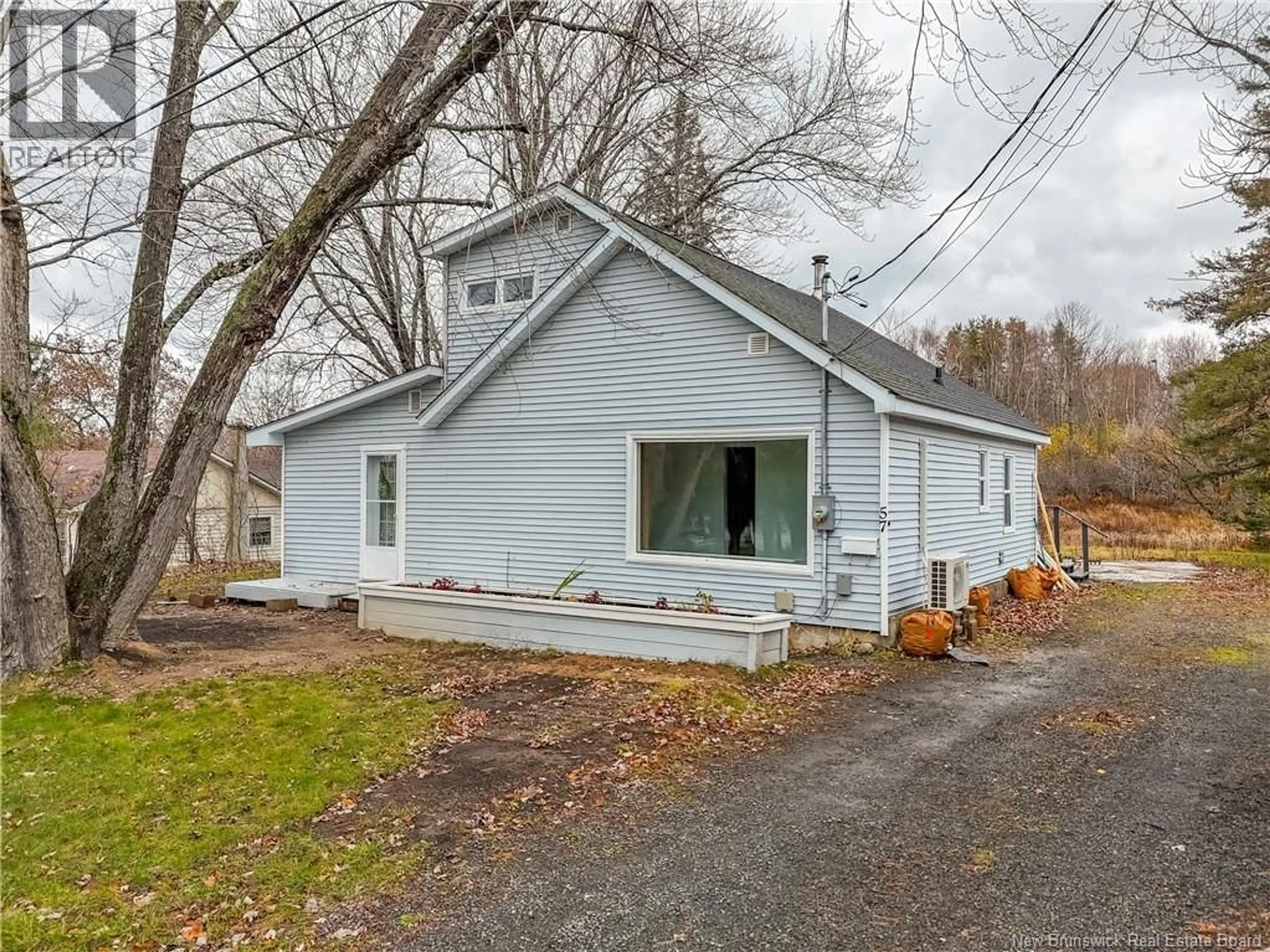 Home with vinyl exterior material, street for 57 FISHER AVENUE, Fredericton New Brunswick E3A4J1