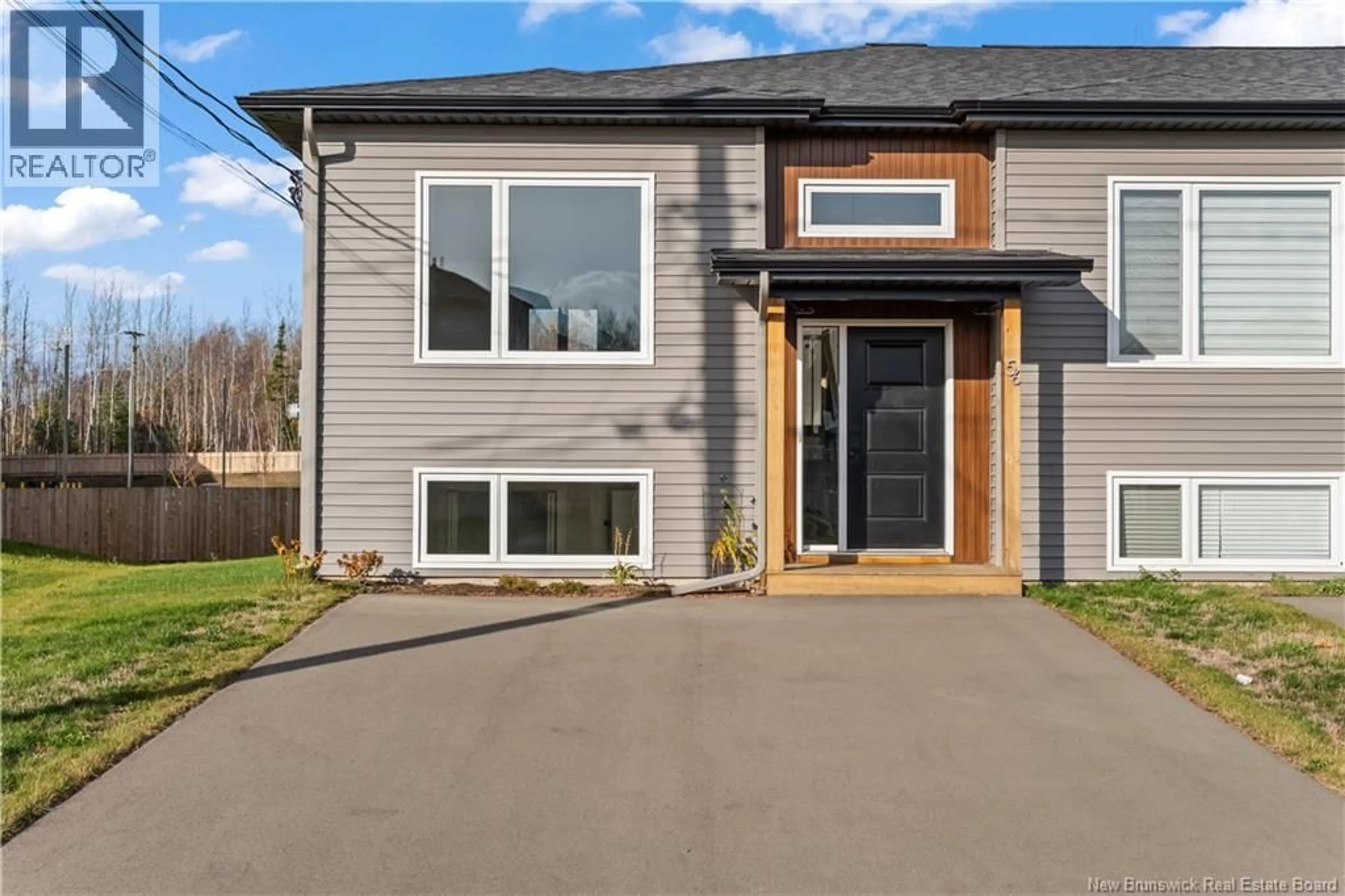 Home with vinyl exterior material, street for 56 DELTA STREET, Dieppe New Brunswick E1K0A4