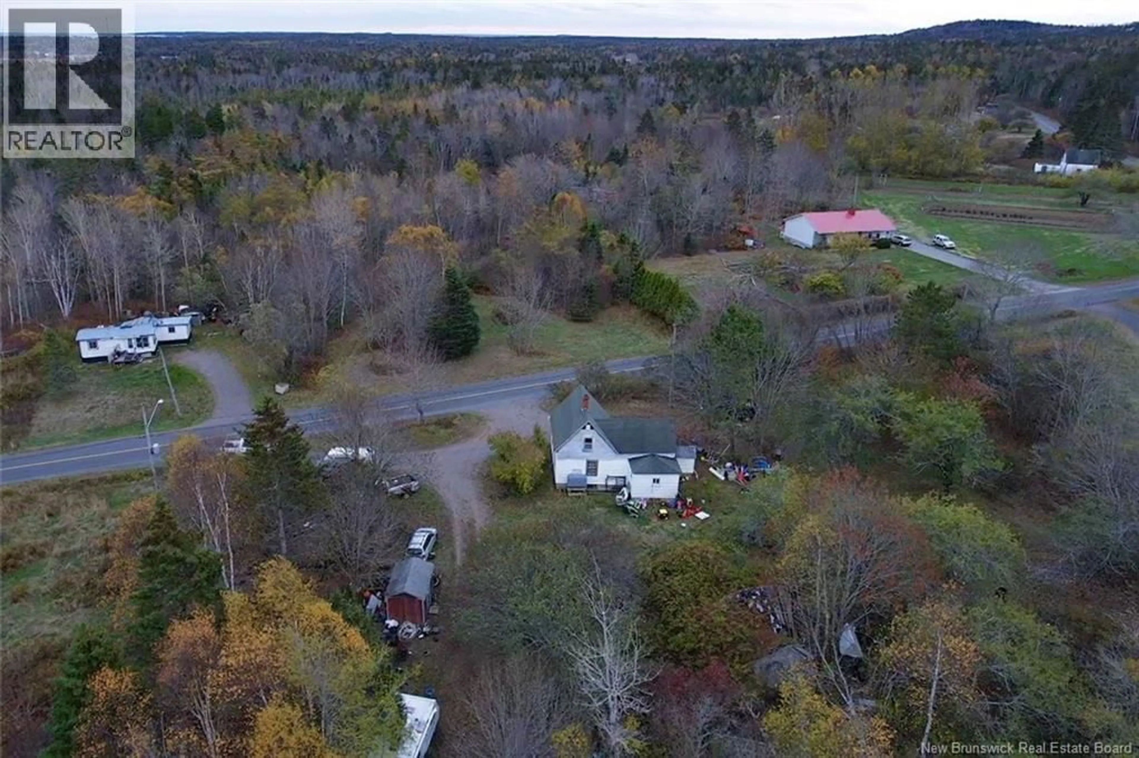 A pic from outside/outdoor area/front of a property/back of a property/a pic from drone, forest/trees view for 90 CEDAR STREET, Grand Manan New Brunswick E5G2C2