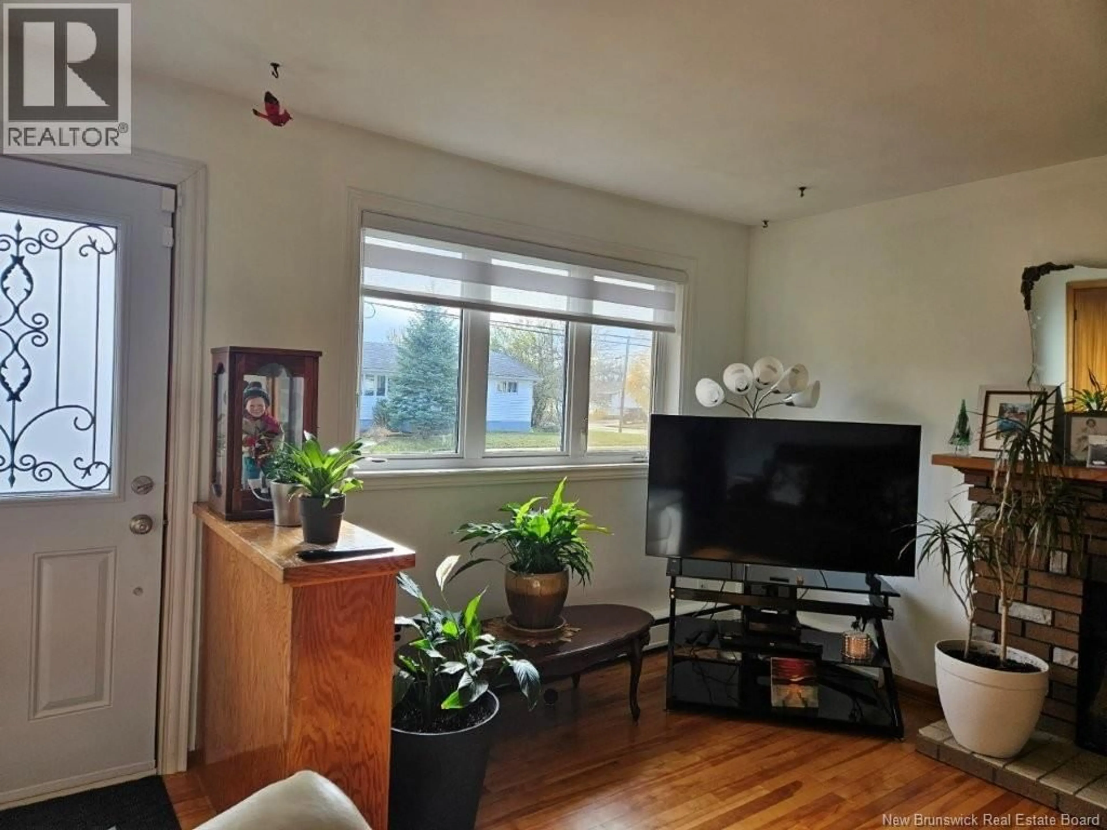 Living room with furniture, wood/laminate floor for 135 CRANDALL STREET, Moncton New Brunswick E1C4E1