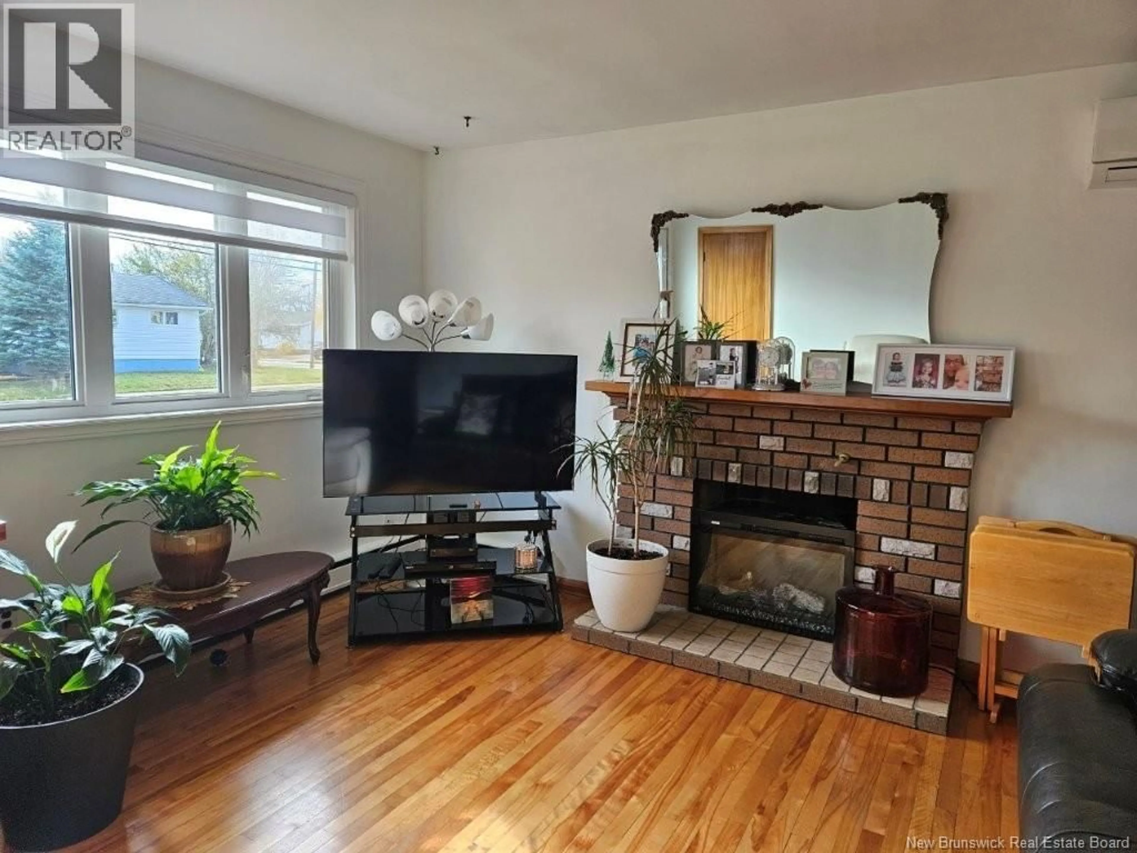 Living room with furniture, wood/laminate floor for 135 CRANDALL STREET, Moncton New Brunswick E1C4E1