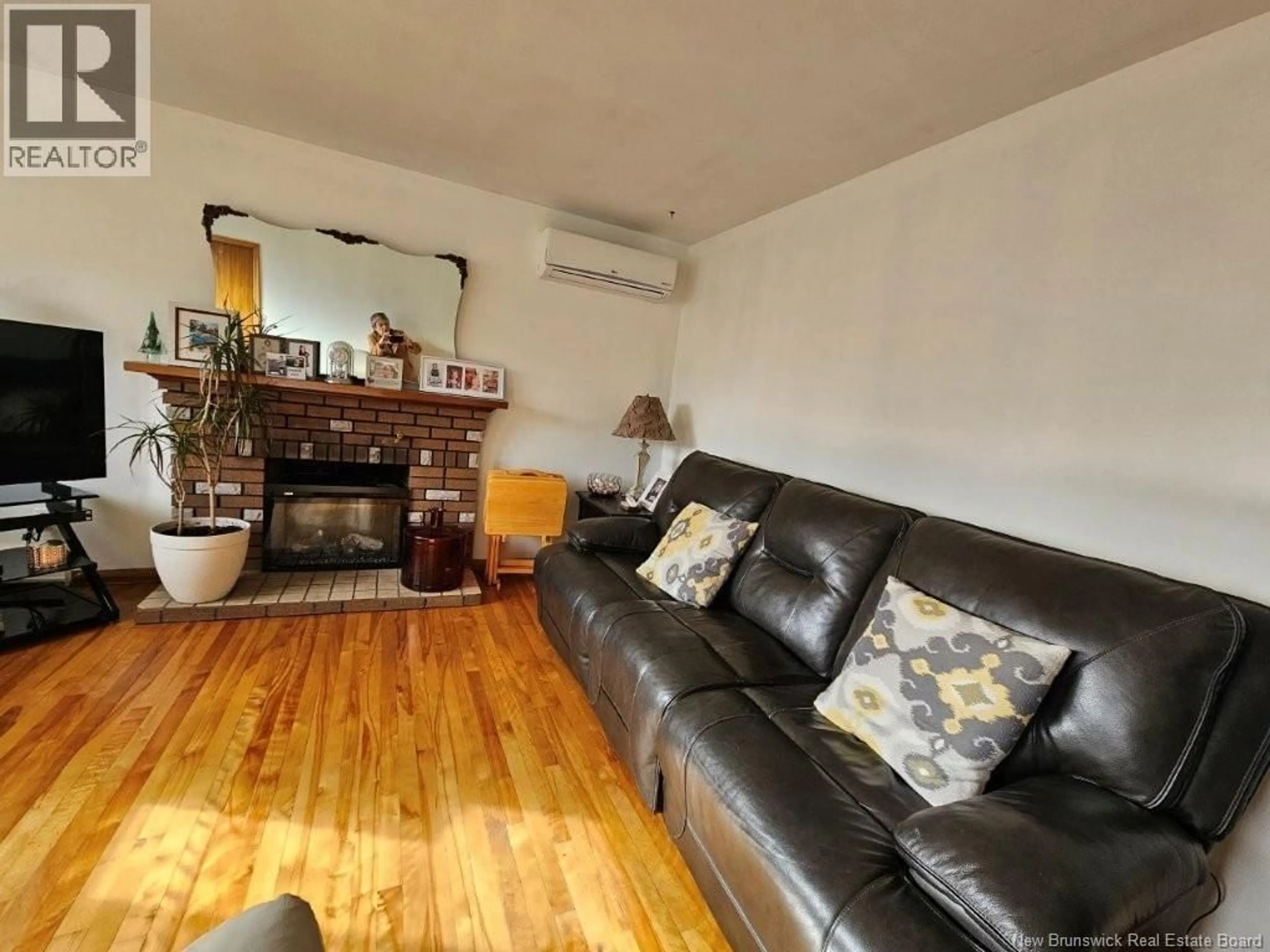 Living room with furniture, wood/laminate floor for 135 CRANDALL STREET, Moncton New Brunswick E1C4E1