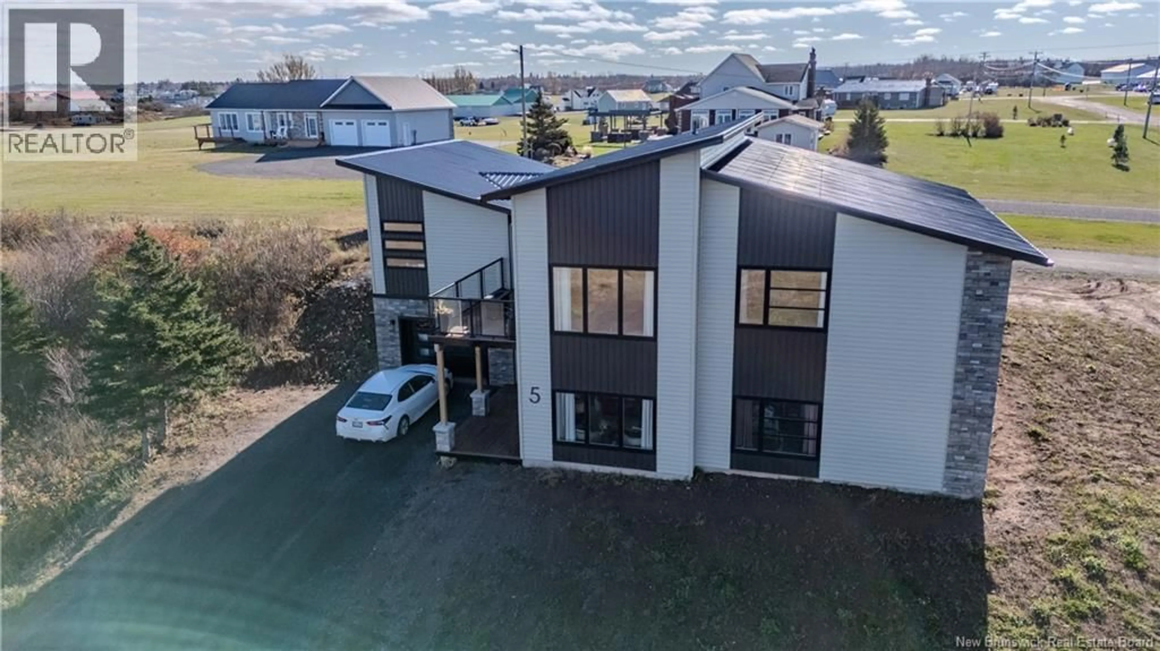 A pic from outside/outdoor area/front of a property/back of a property/a pic from drone, building for 5 ALLEE MACON, Bas Cap Pele New Brunswick E4N1X2