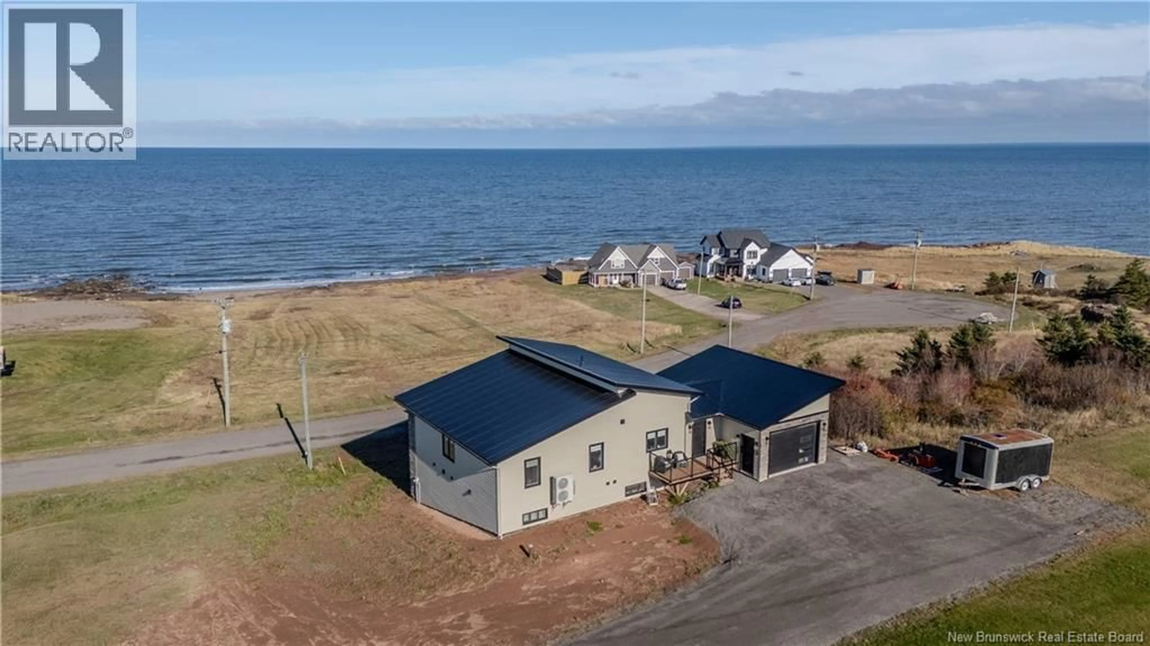 A pic from outside/outdoor area/front of a property/back of a property/a pic from drone, water/lake/river/ocean view for 5 ALLEE MACON, Bas Cap Pele New Brunswick E4N1X2